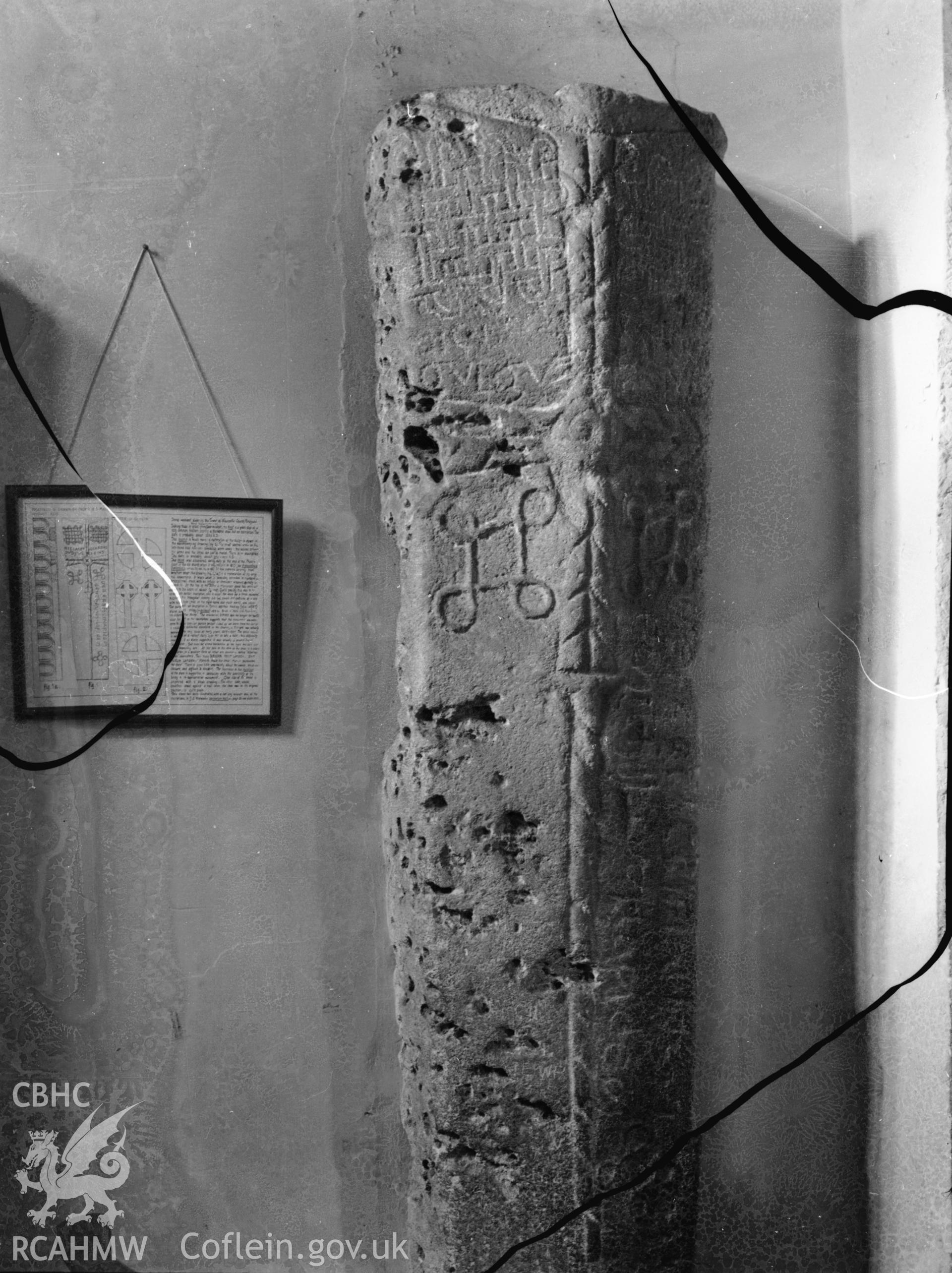 Black and white photo showing inscribed stone in a Bridgend Church.