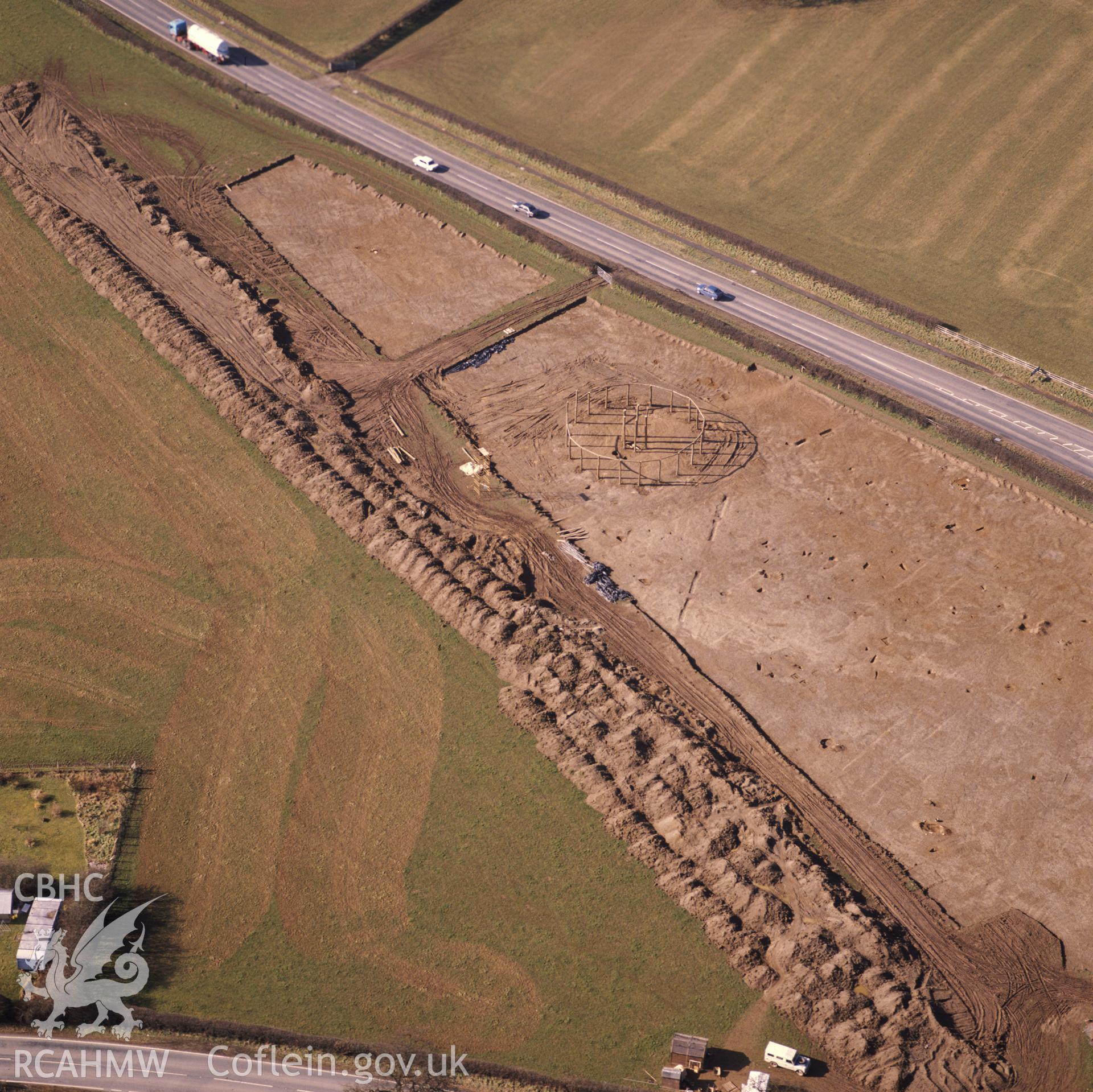 RCAHMW colour oblique aerial photograph of Sarn Bryn Caled Pit Circle. Taken by C R Musson 1991