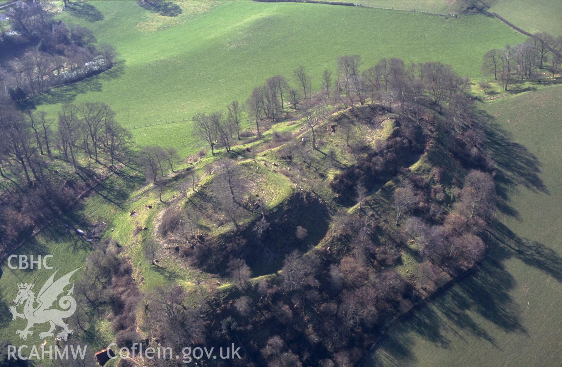 RCAHMW colour slide aerial photograph of Cefnbryntalch Motte and Bailey. Taken by C R Musson on 21/03/1995