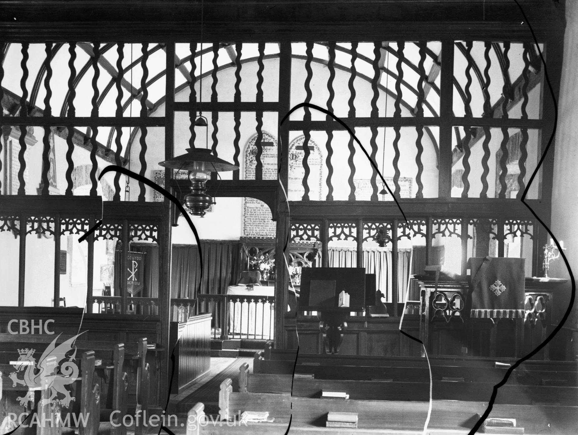 Black and white photo showing the screen and altar at Aberedw Church.