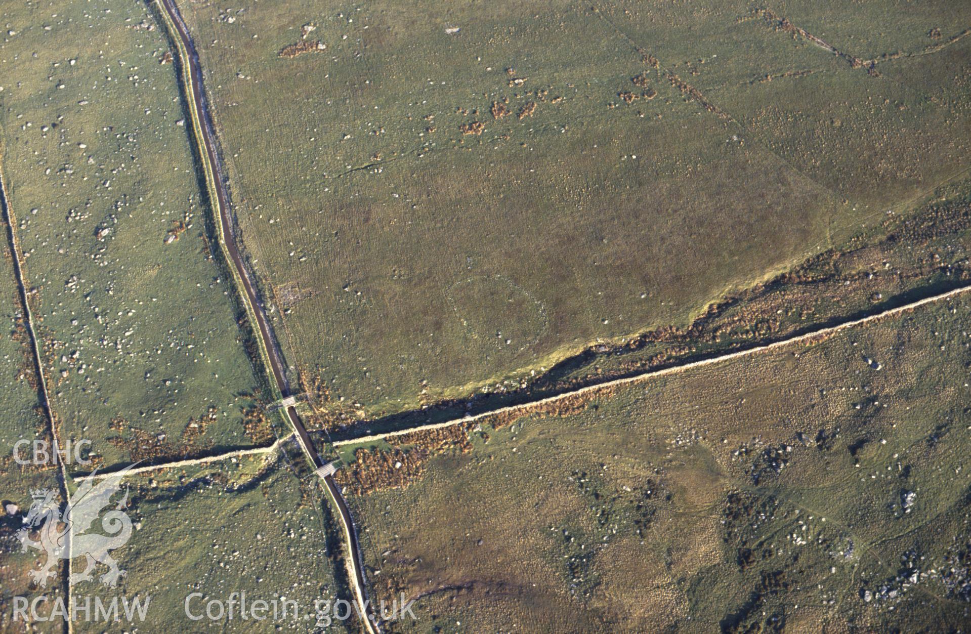 RCAHMW colour slide oblique aerial photograph of Enclosure NW of Tal-y-braich, Capel Curig, taken by C.R. Musson, 30/05/94