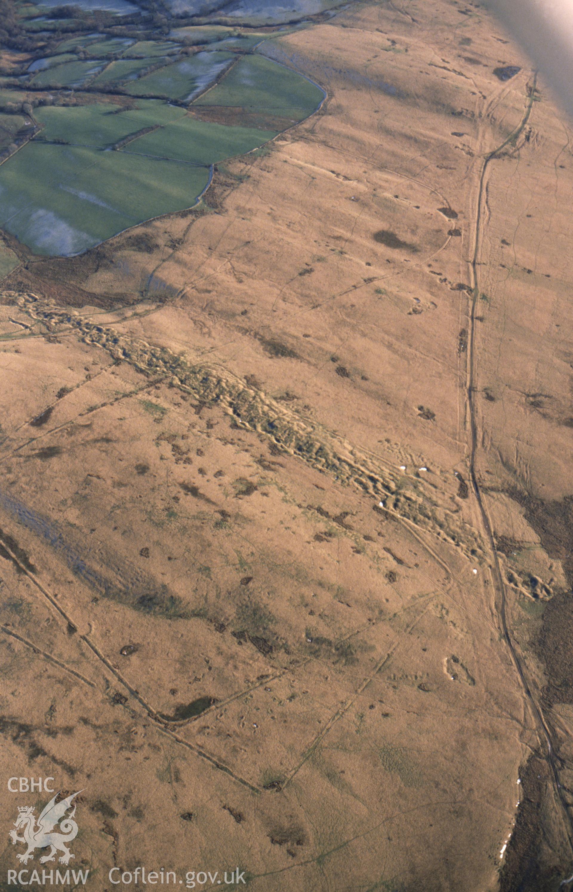 RCAHMW colour slide oblique aerial photograph of a mound close to the Y Pigwn Marching Camps, Myddfai, taken on 27/01/1992 by CR Musson