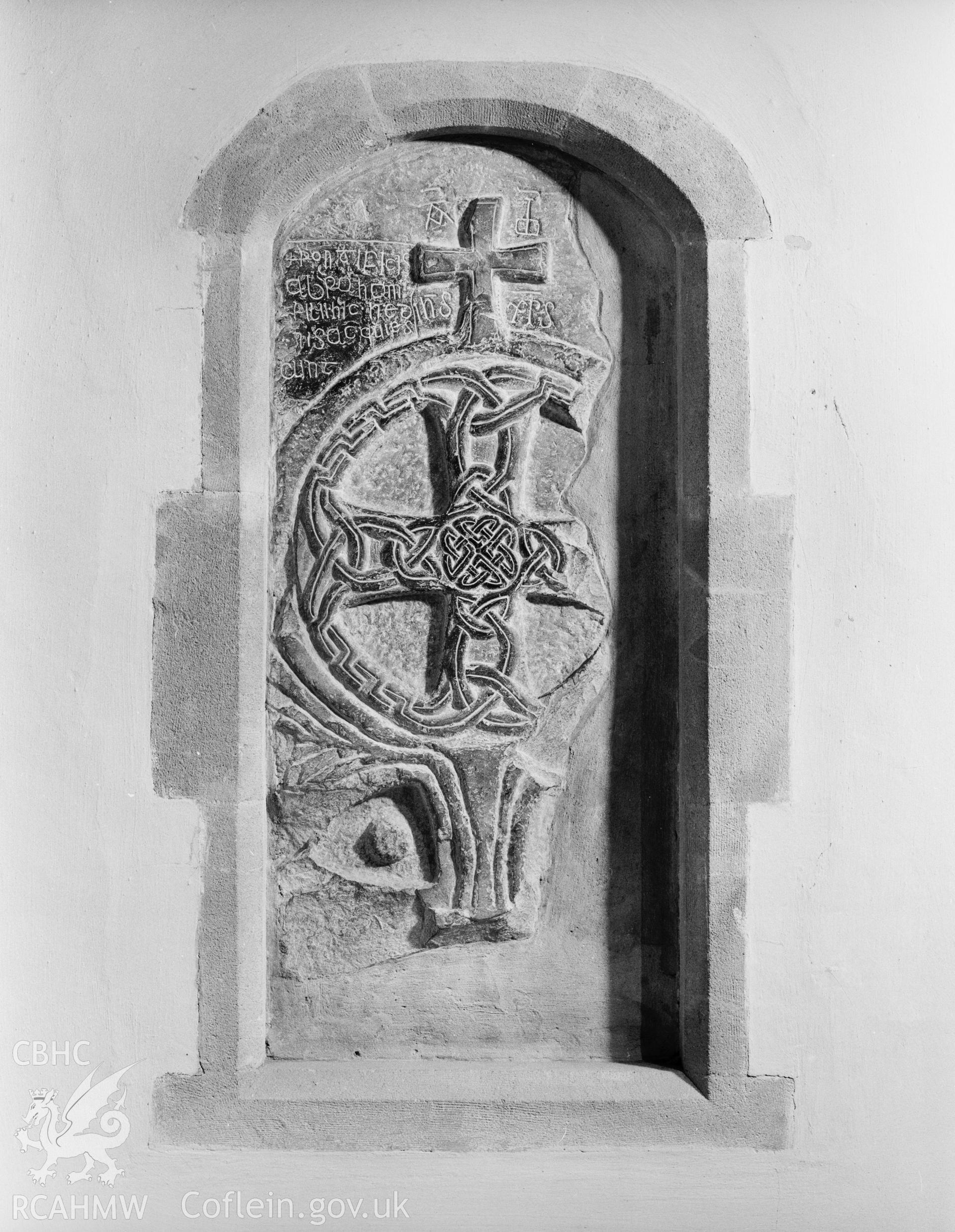 Cross-slab in Porth y Twr, St David's Cathedral, commemorating the sons of Bishop Abraham;  black and white photograph produced by  RCAHMW for the proposed Early Christian Monuments publication.