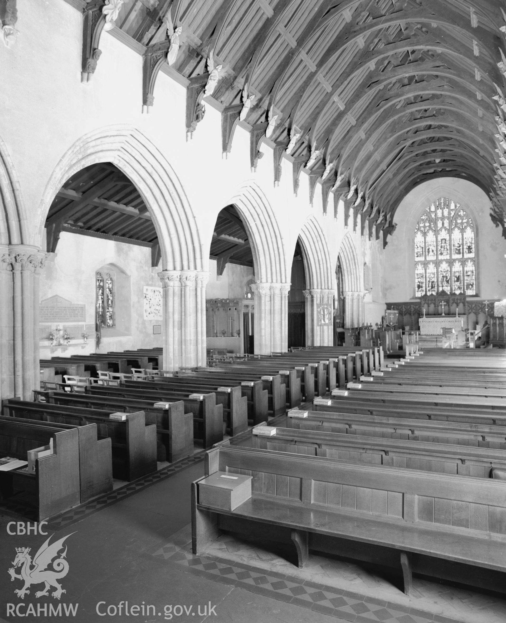 Black and white photograph showing the interior of St Idloes Church, Llanidloes taken by RCAHMW 1988.