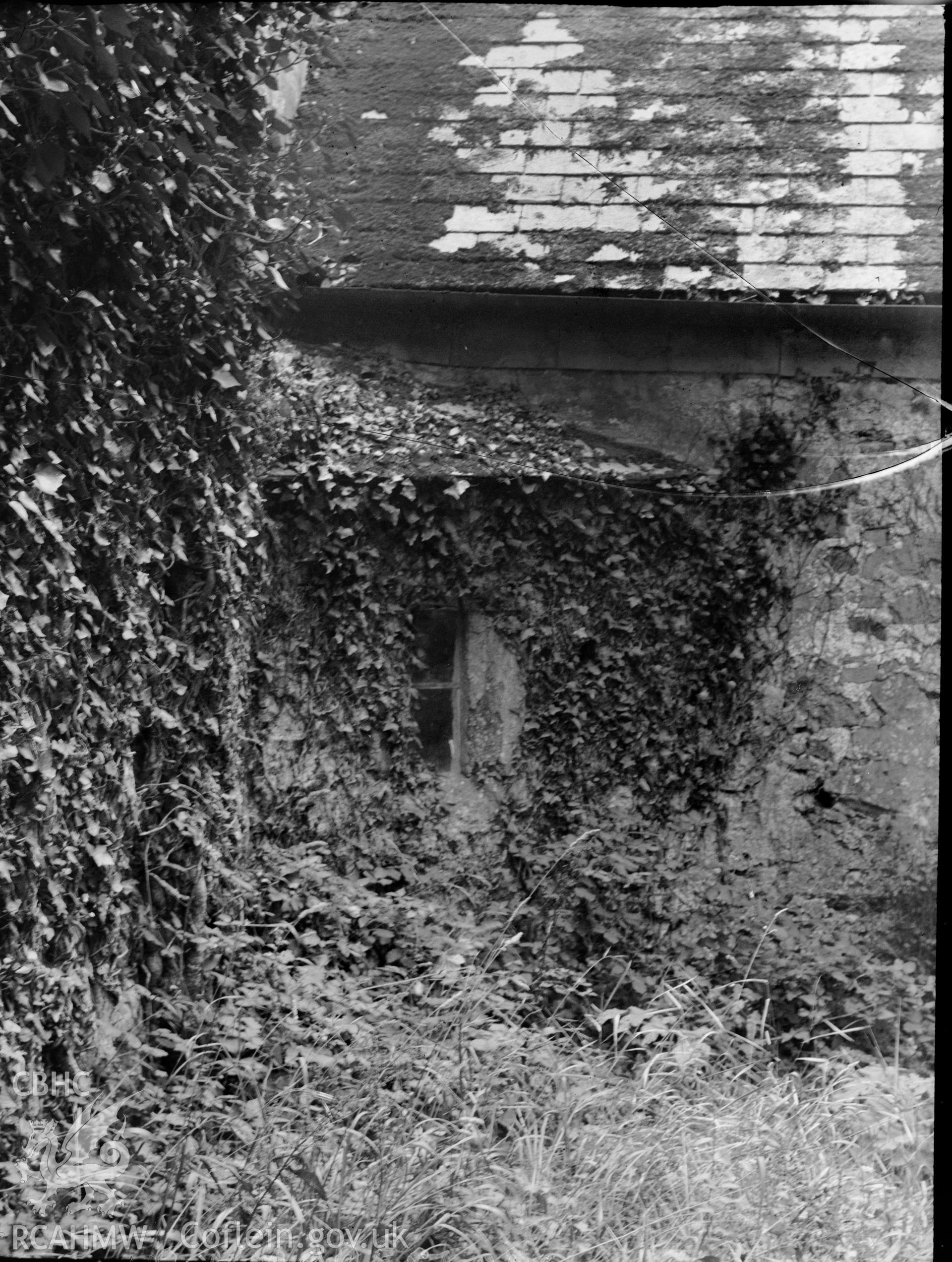 Black and white photo showing side wall of Gumfreston Church.