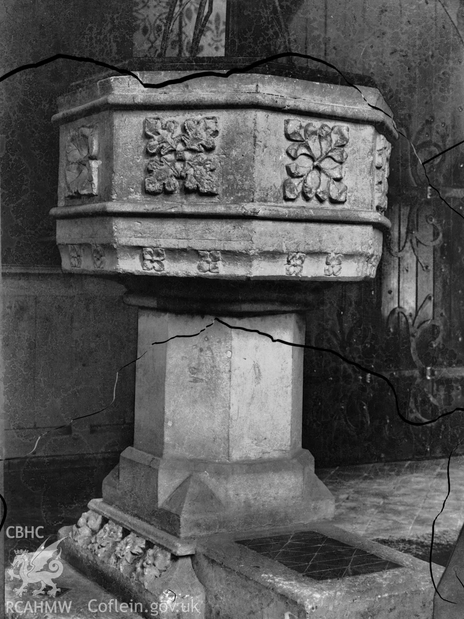 Black and white photo showing the font at St Mary's Church, Cardigan.