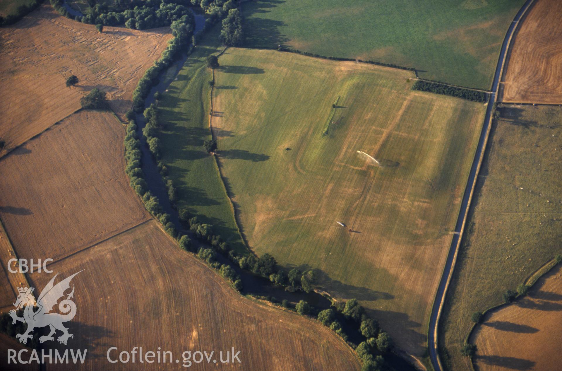 Slide of RCAHMW colour oblique aerial photograph of Forden Gaer, taken by C.R. Musson, 1990.