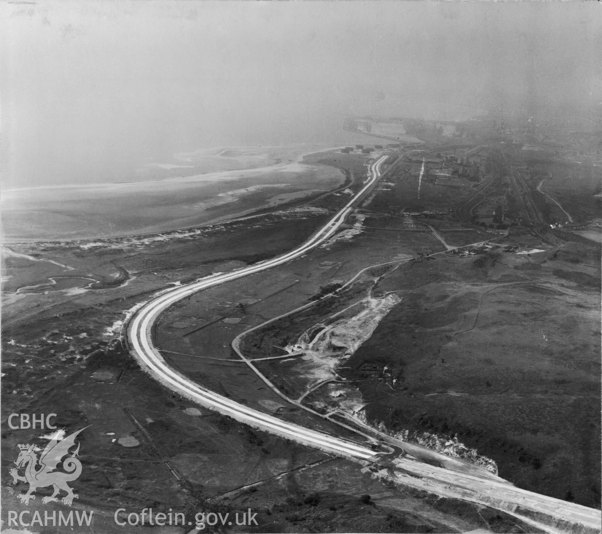 Black and white oblique aerial photograph looking west at Fabian Way during construction in 10.08.1948. Aerofilms album Swansea (W30).