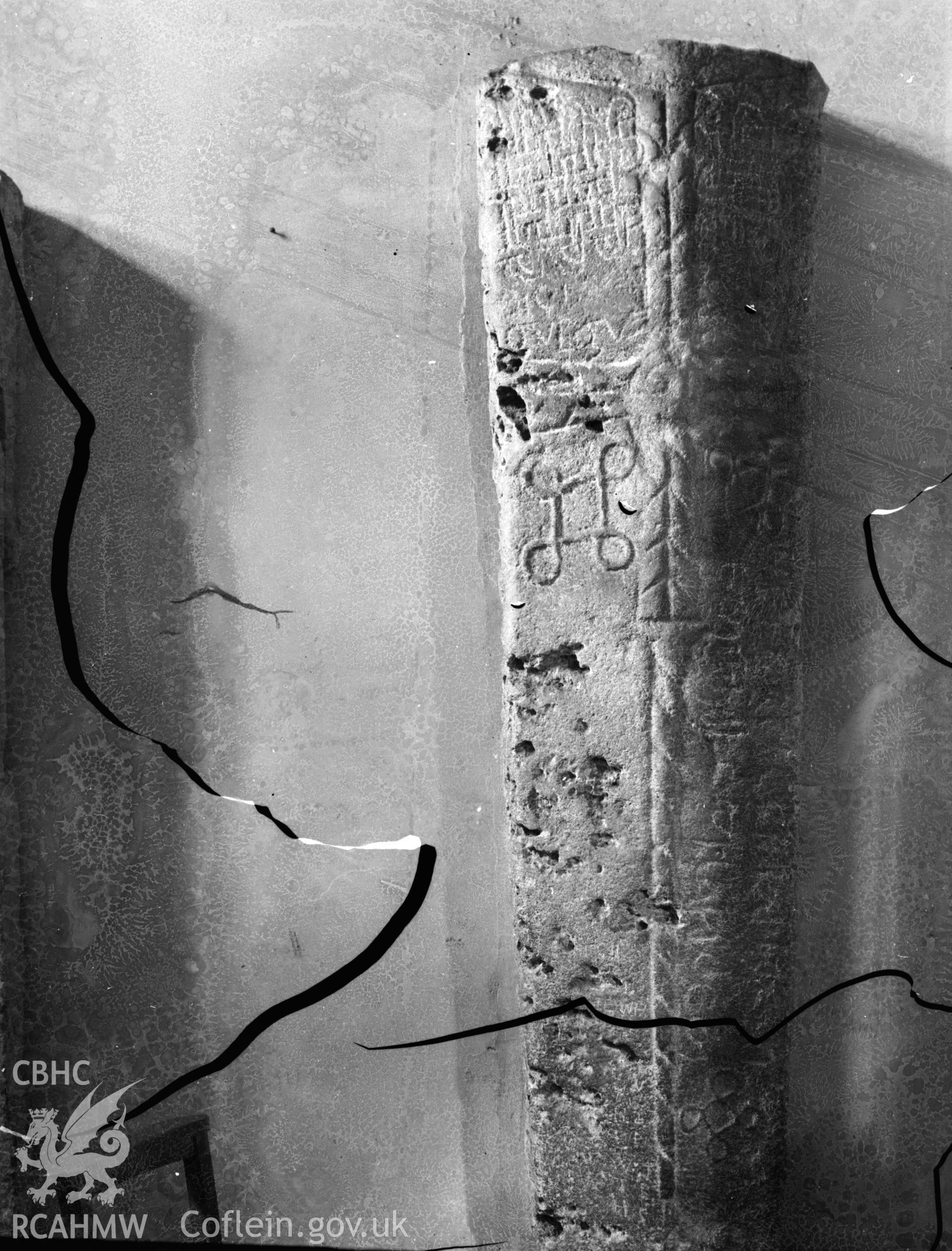 Black and white photo showing inscribed stone in a Bridgend Church.