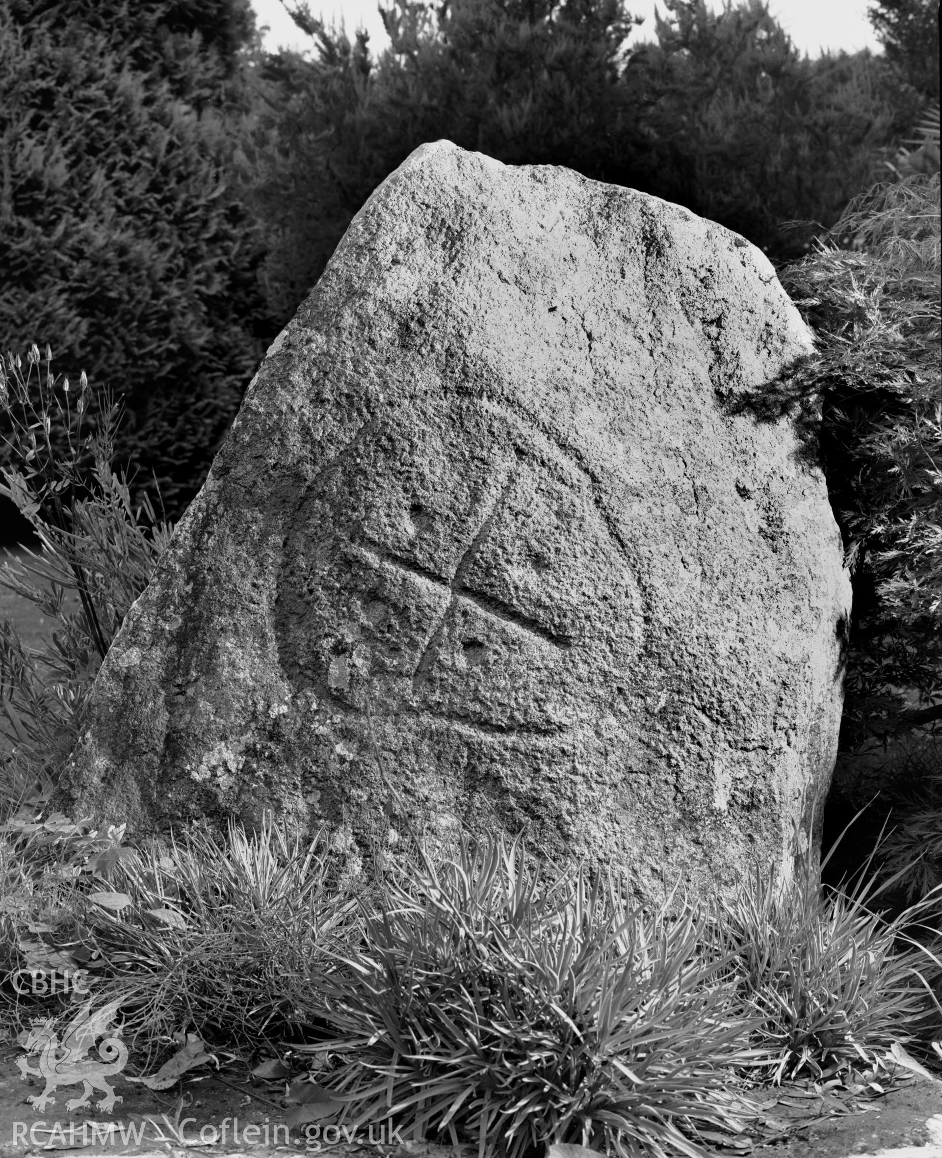 Black and white photograph showing the Maen y Groes inscribed stone near St Mary's Churchyard, Newport, taken by RCAHMW 1987.