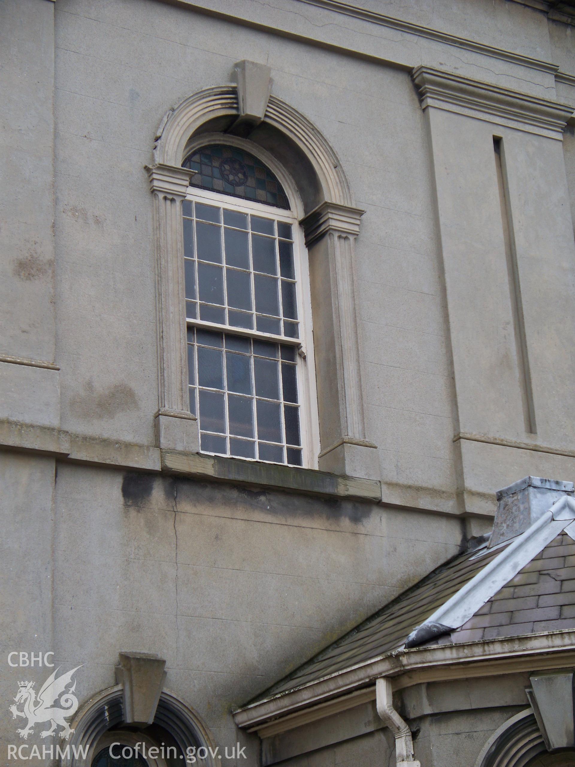 Memorial slabs from original burial yard laid flat along west Wern Road chapel side.