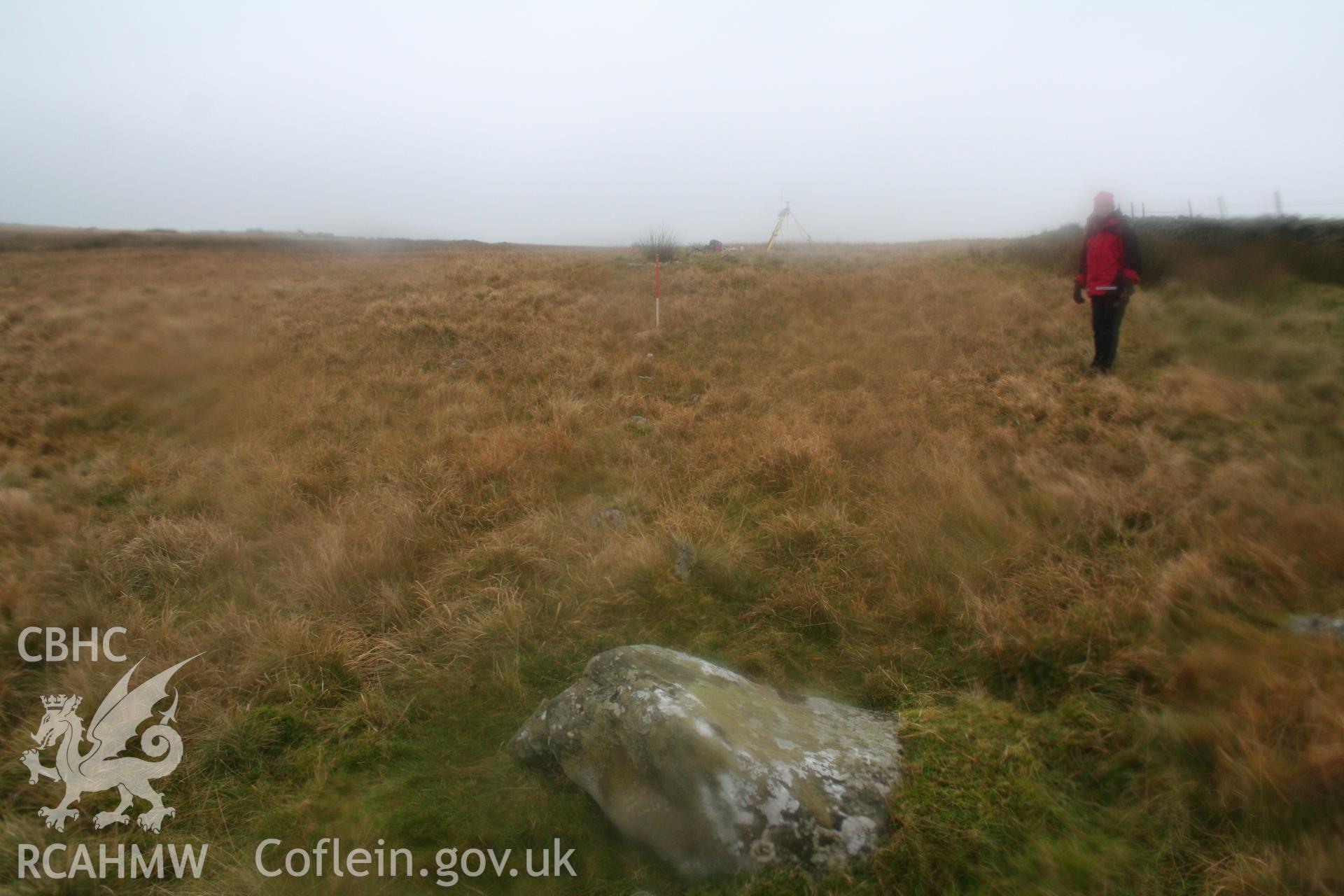 View from the north-east along line of stones towards the cairn.