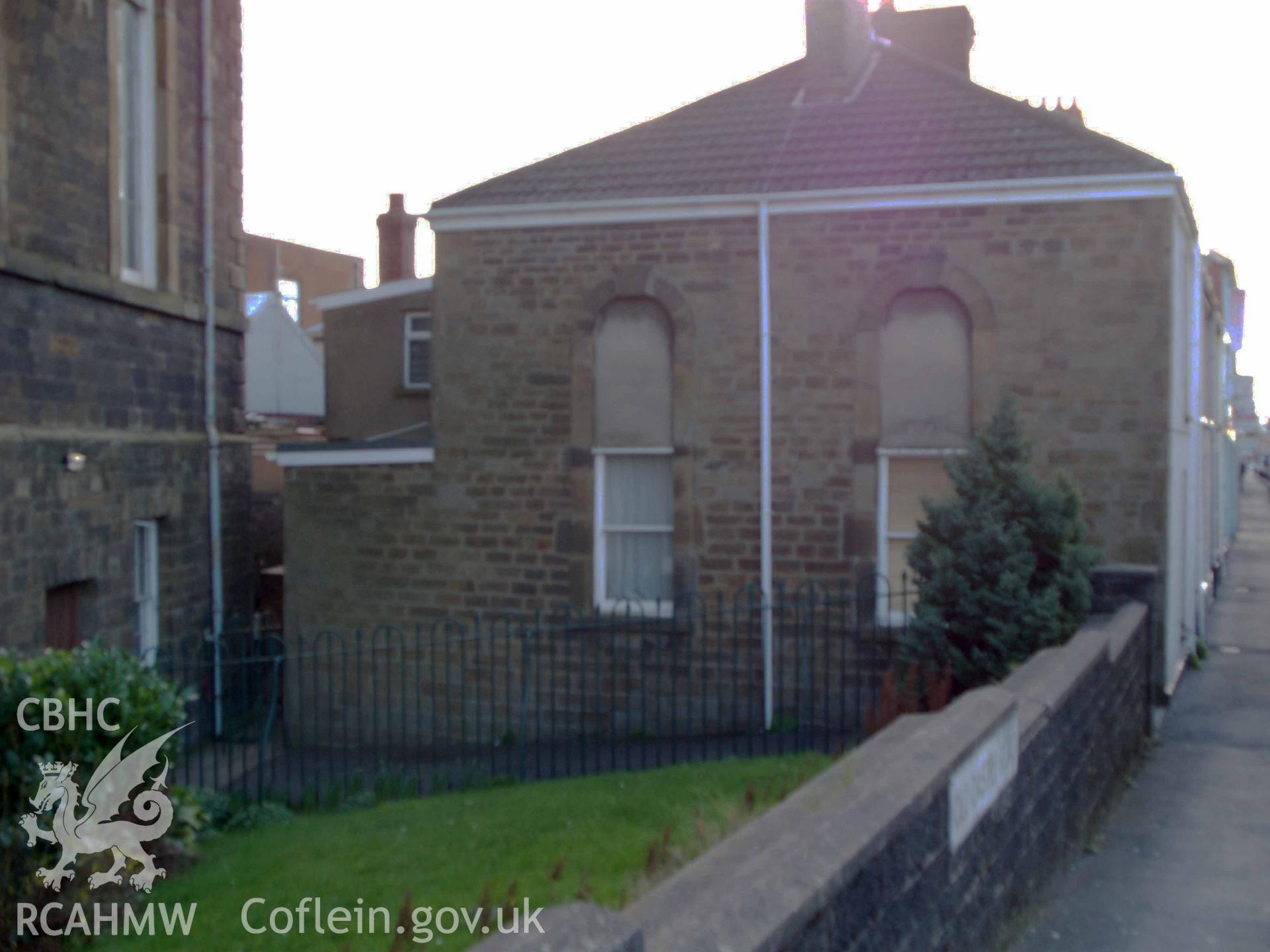 Chapel caretaker?s house at rear of NW side.