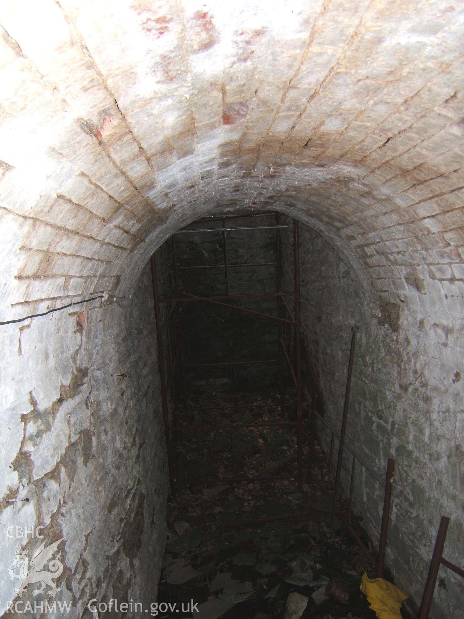 Interior of cable tunnel looking from water-turbine house to base of shaft into octagonal turret at head of cable railway to Park Farm.