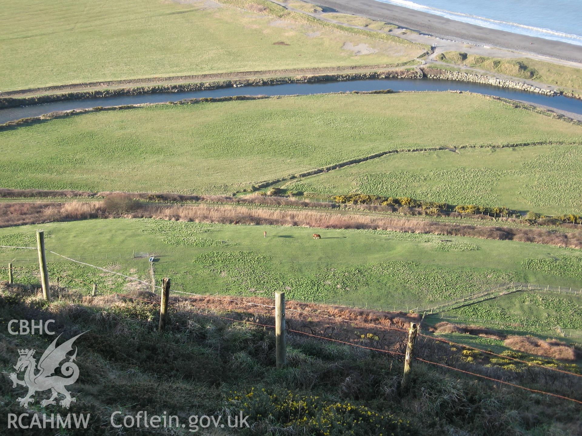 Tanybwlch enclosure. Wide view from north-east from summit of Pen Dinas, showing ridge and furrow to north.