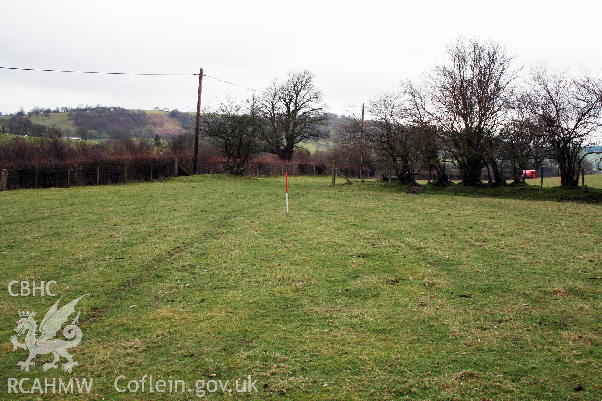 View of plough-levelled barrows (site of) from north, 1m scale