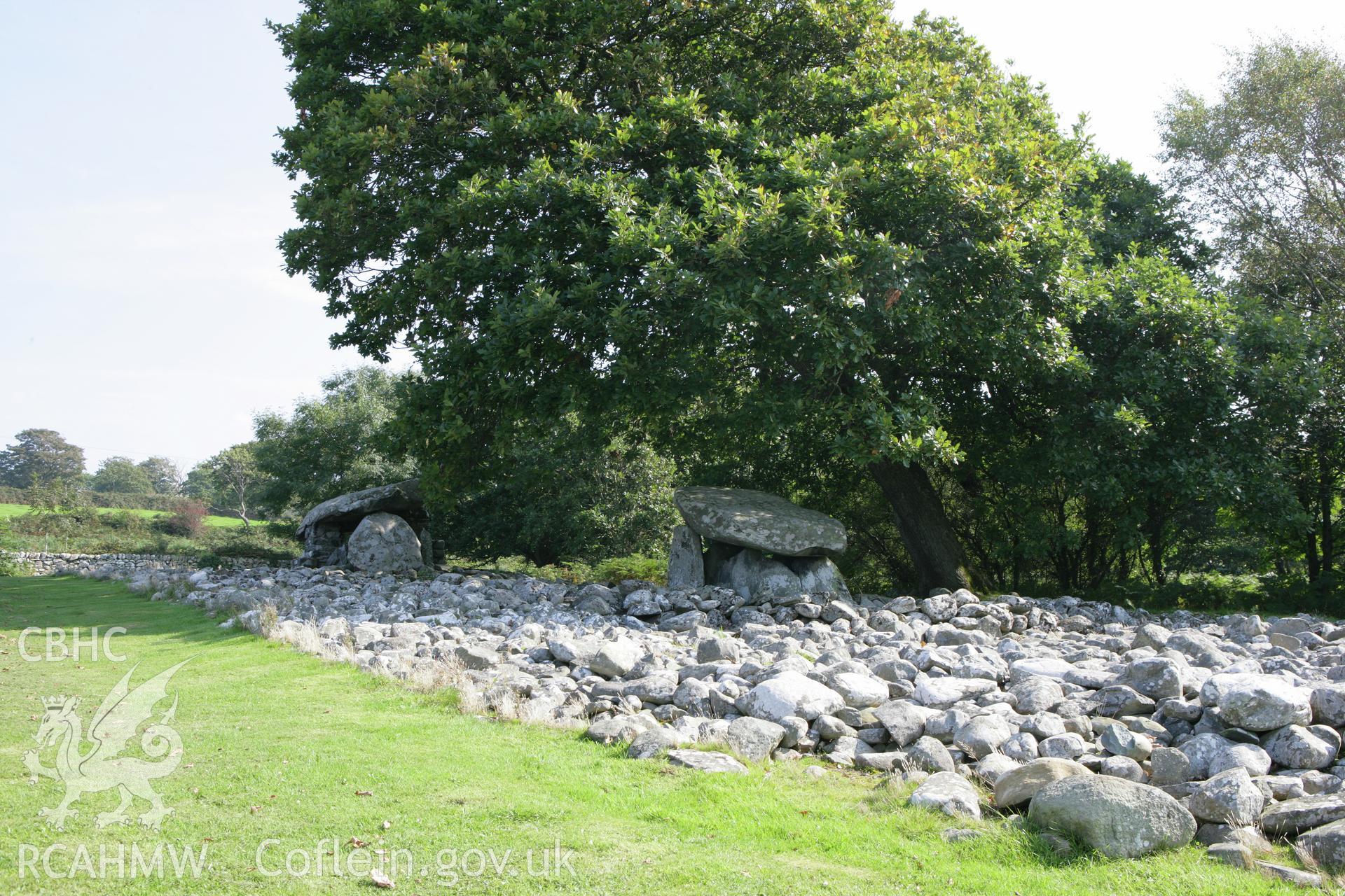 General view of tombs and cairn from west