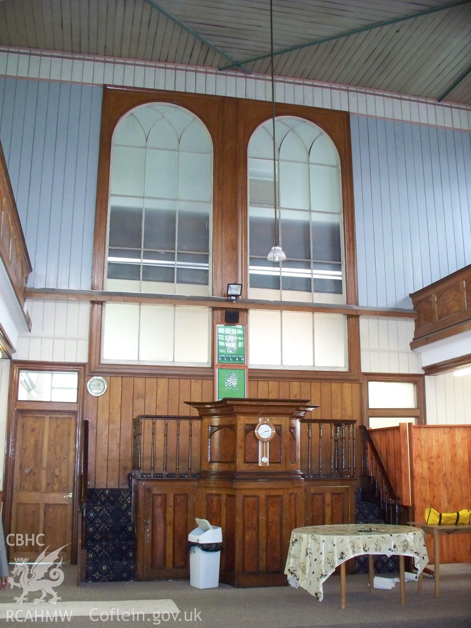 Platform pulpit against rear wall.