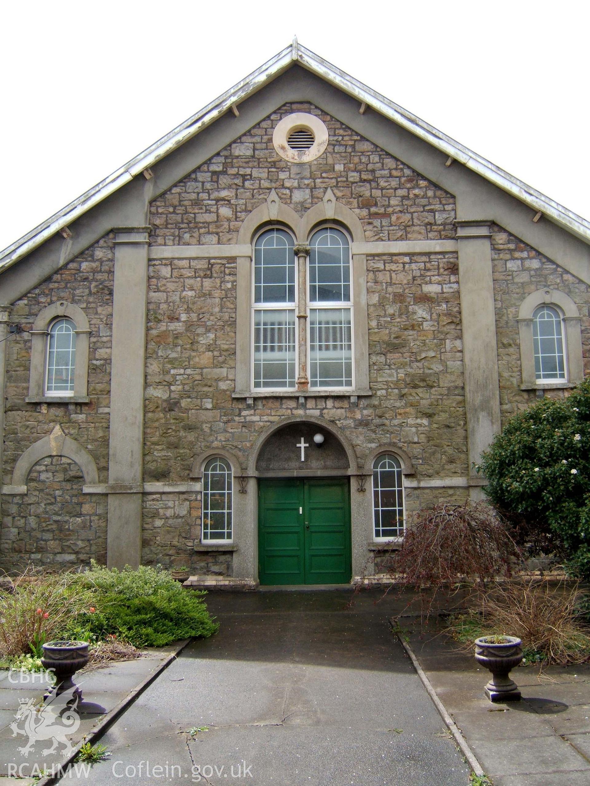 North gable-end door with double round-headed window above & circular attic vent.