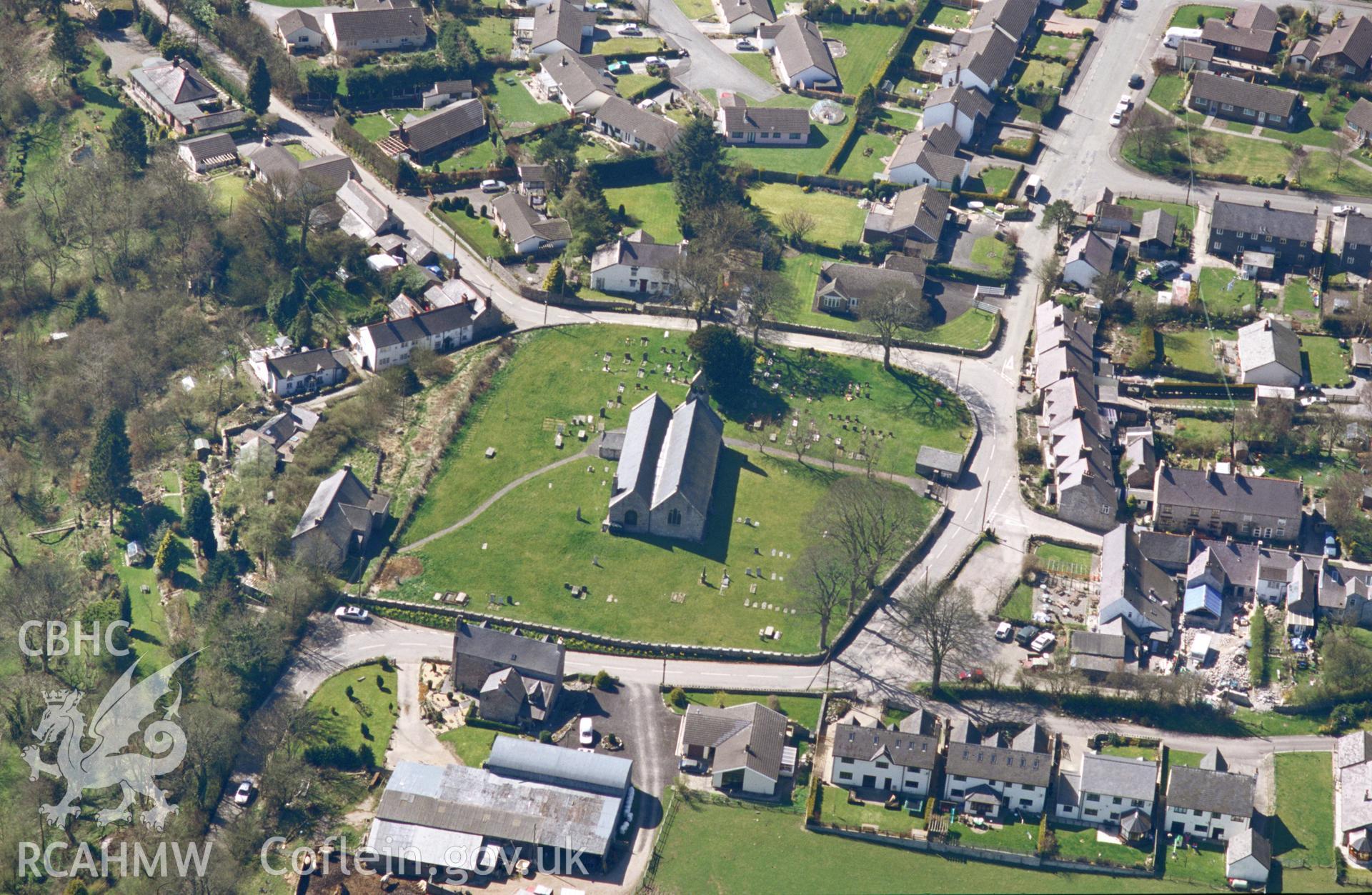 RCAHMW colour oblique aerial photograph of St Garmon's Church, Llanarmon-yn-Ial. Taken by Toby Driver on 08/04/2003