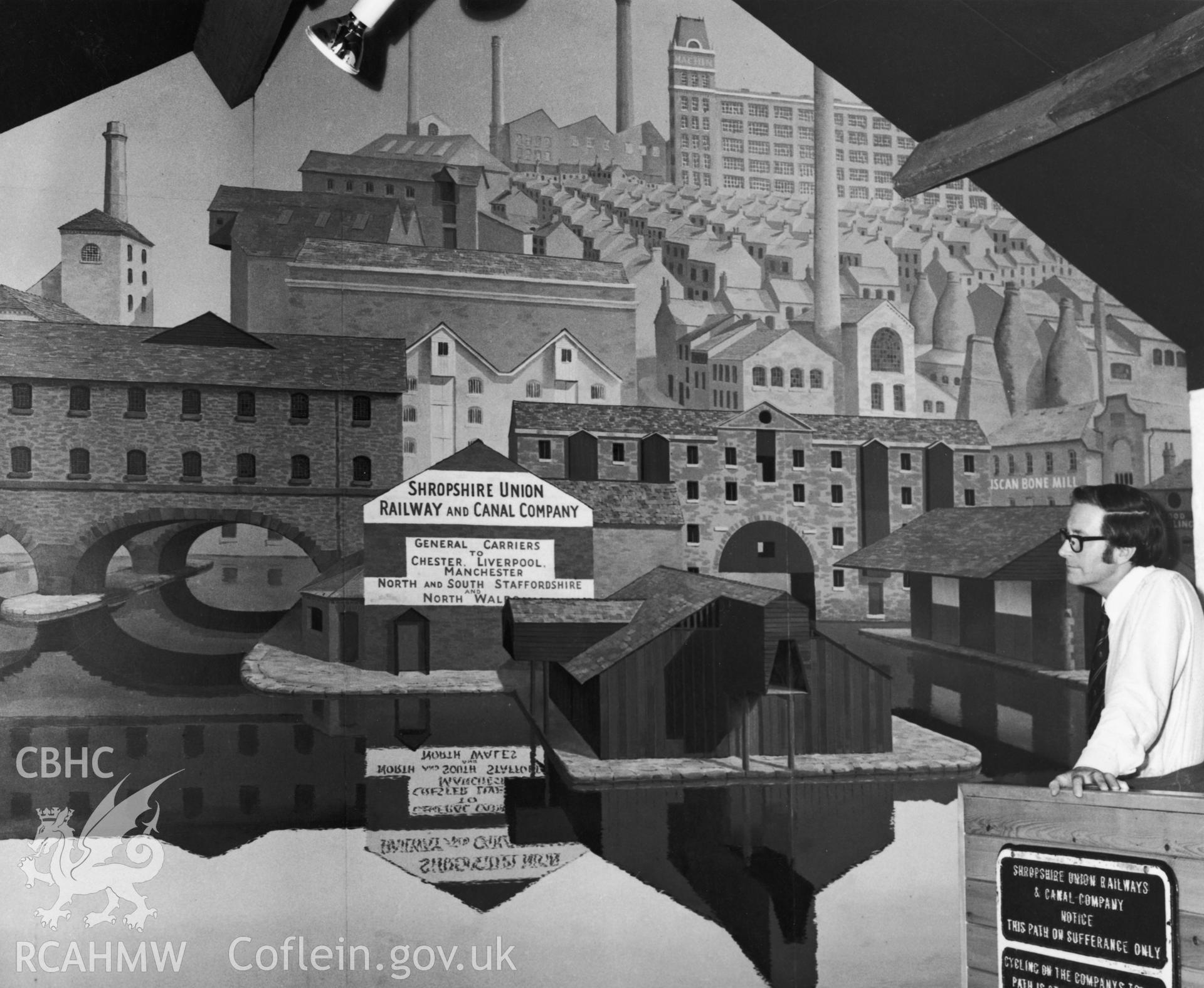 1 b/w print showing interior view of the Llangollen Canal Museum showing wall mural; collated by the former Central Office of Information.