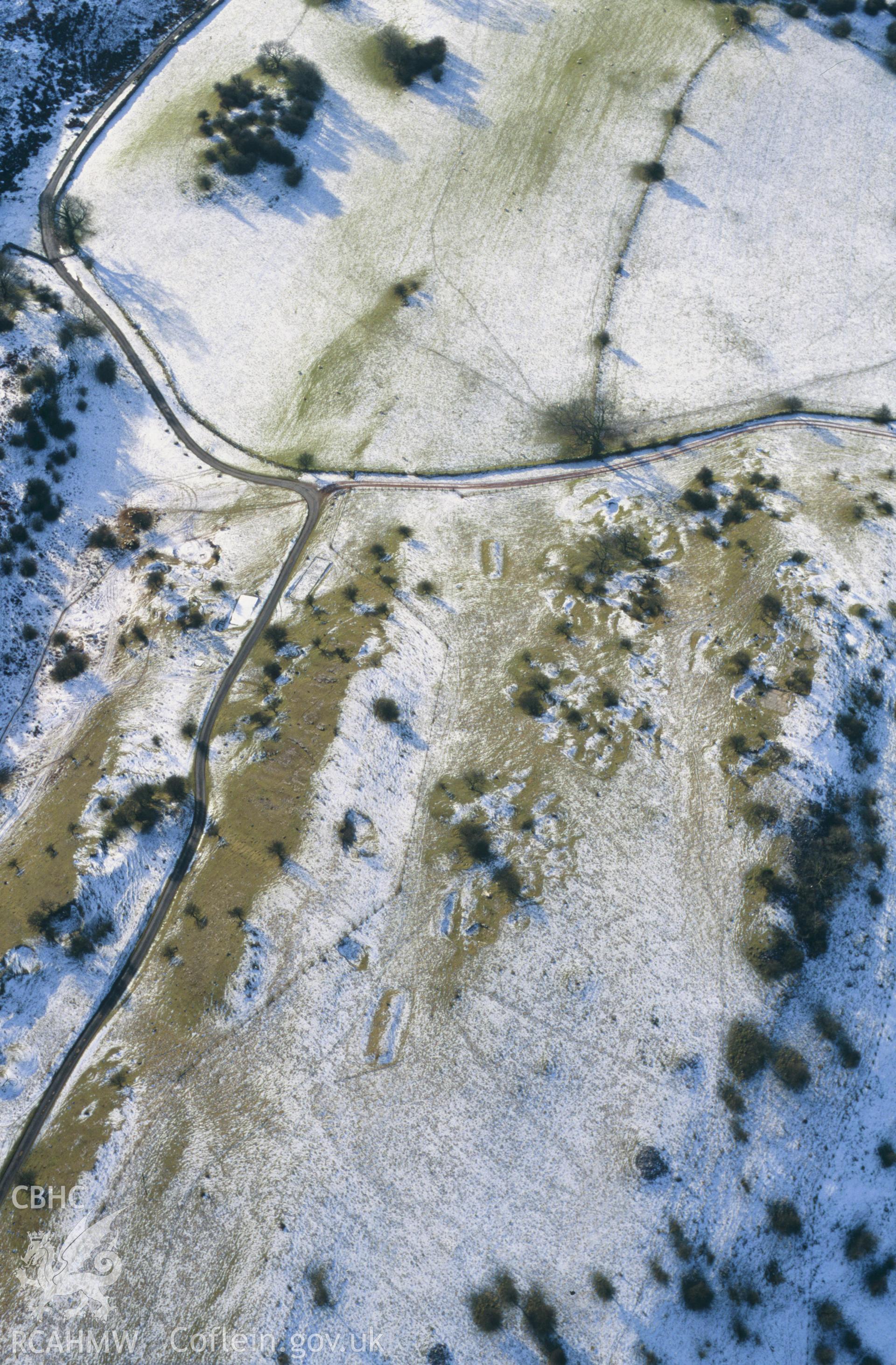 RCAHMW colour oblique aerial photograph of Beddau'r Derwyddon, pillow mounds, from NE. Taken by Toby Driver on 10/01/2003