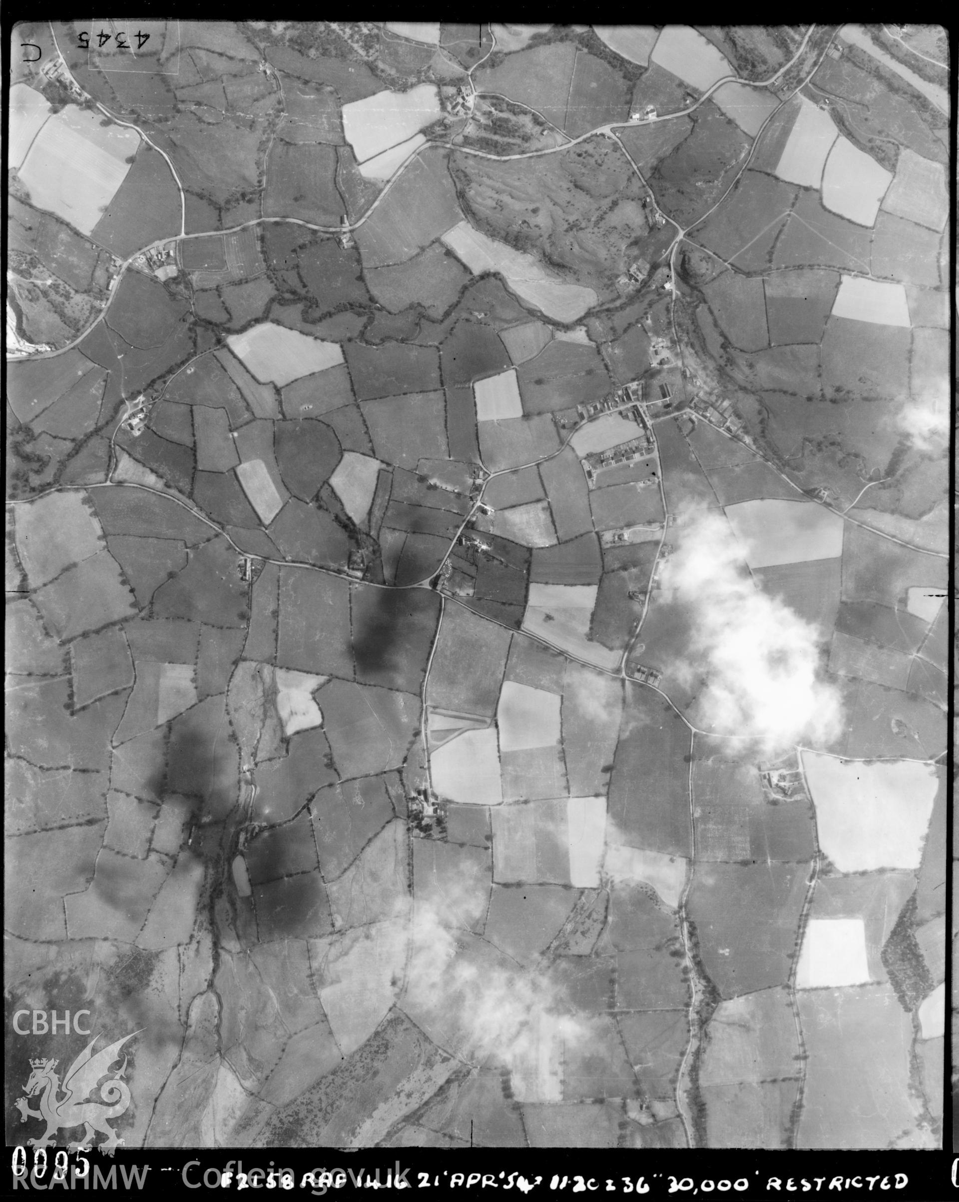 Black and white vertical aerial photograph, taken by the RAF, showing the Llanarmon yn Ial area. 1954.