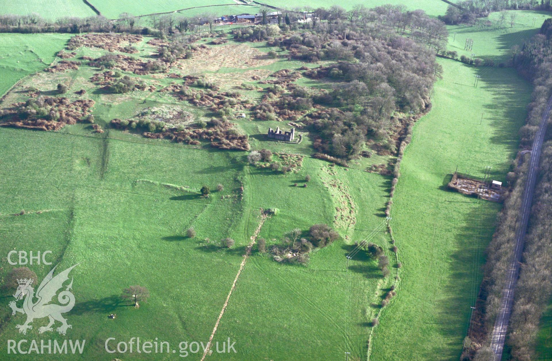 RCAHMW colour slide oblique aerial photograph of Runston Settlement Earthworks, Mathern, taken by C.R. Musson, 24/03/94