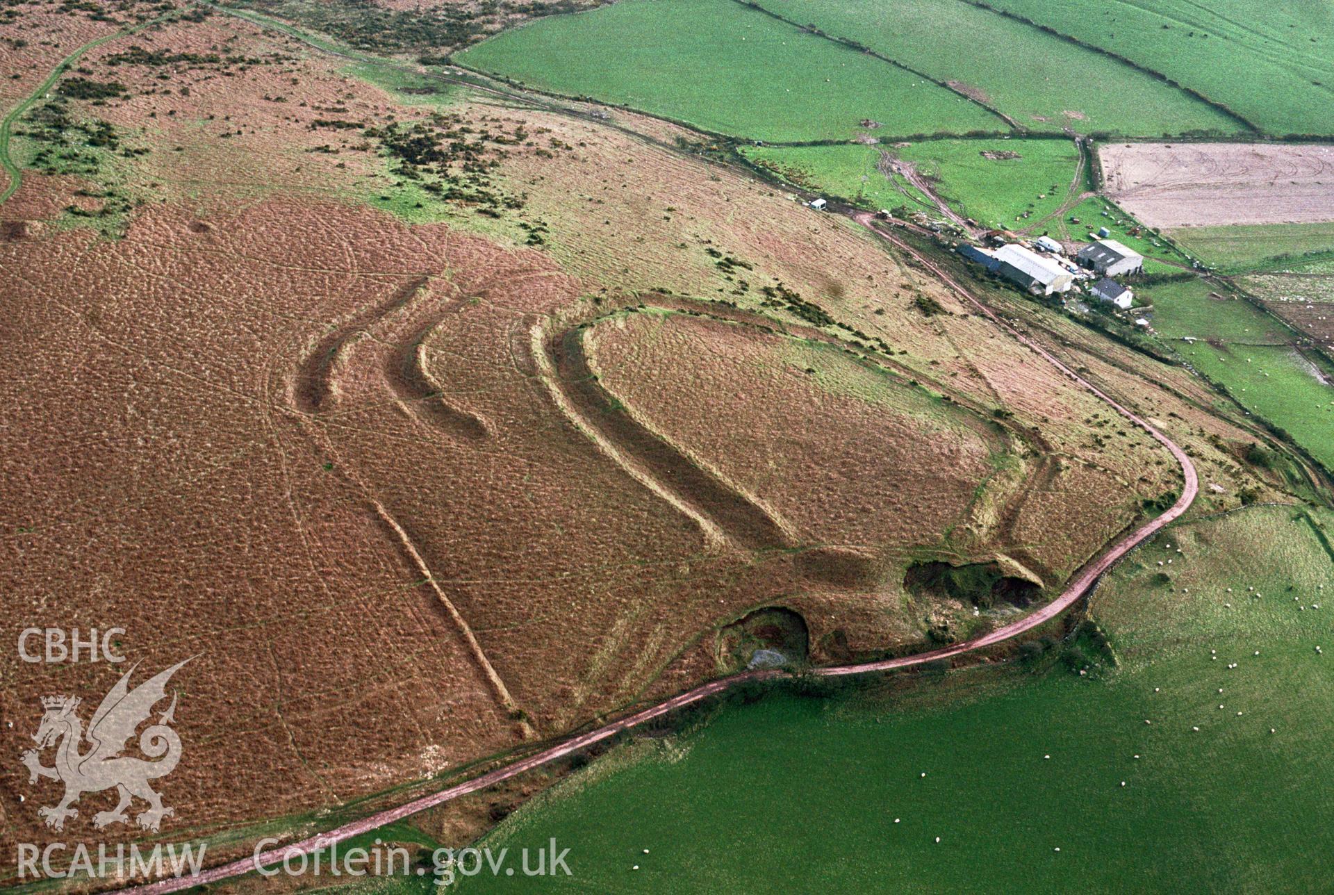 RCAHMW colour slide oblique aerial photograph of Hardings Down West Fort, Llangennith, Llanmadoc and Cheriton, taken by C.R. Musson, 29/03/94