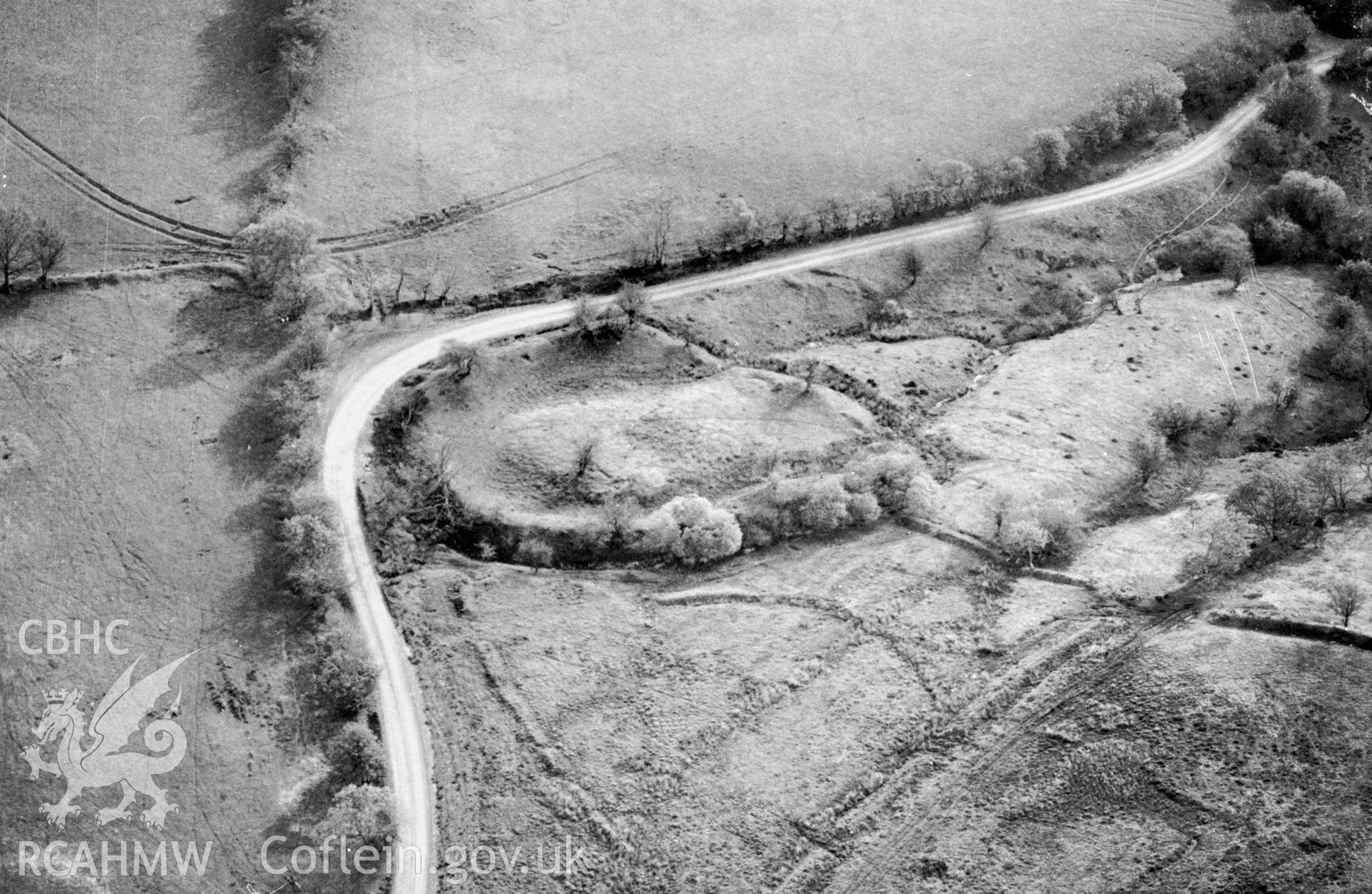 RCAHMW Black and white oblique aerial photograph of Clawdd Brythonig;  Clawdd British, Maescar, taken by T.G.Driver on the 03/05/1997