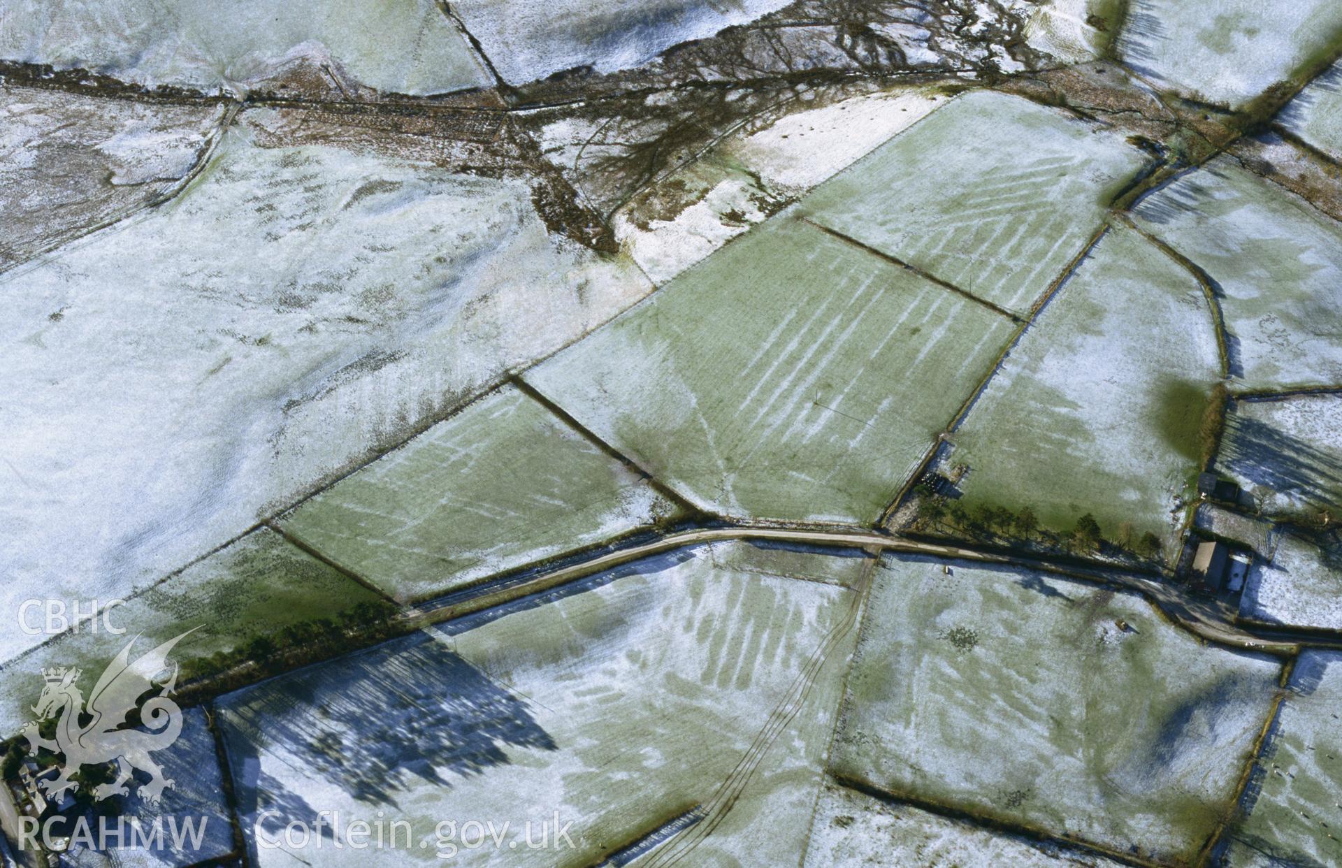 RCAHMW colour slide aerial photograph of Cwm Nant marching camp, St Harmon, under snow. Taken by Toby Driver on 31/01/2003