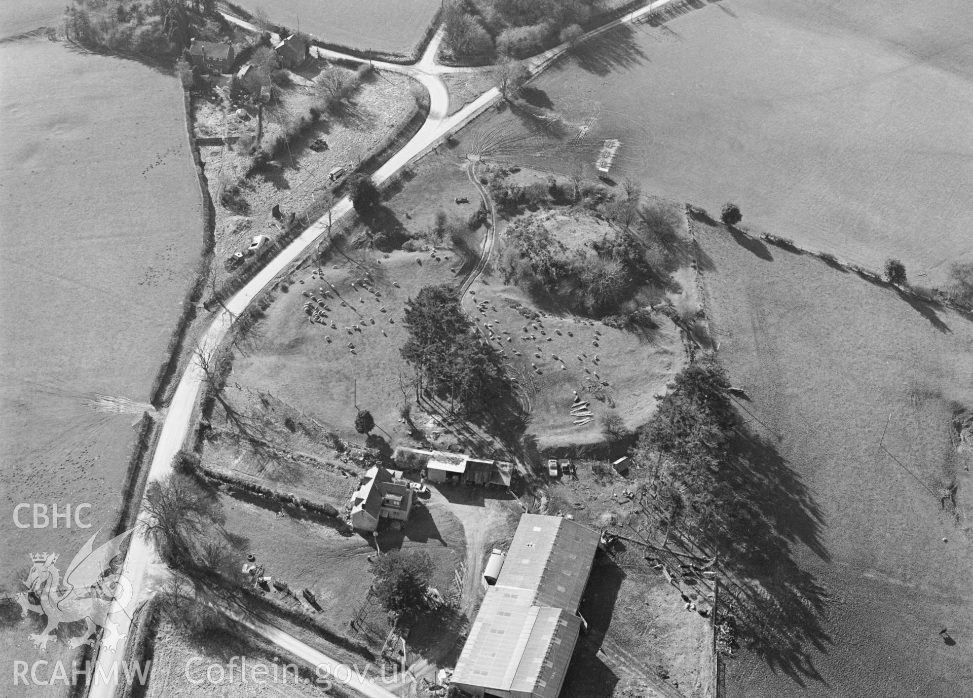 RCAHMW black and white aerial photograph of Bishops Moat, Motte and Bailey. Taken by C R Musson on 13/03/1995