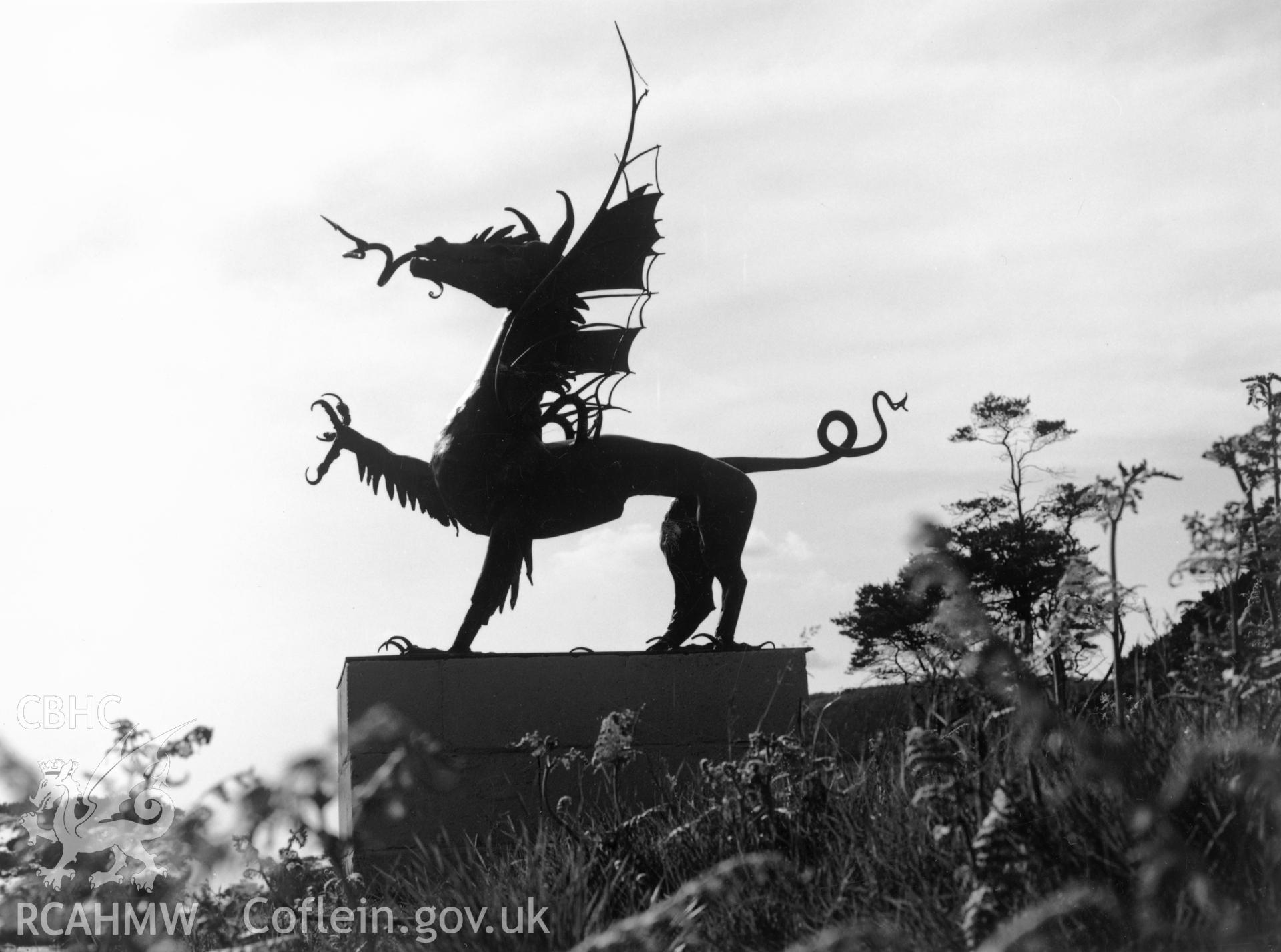 1 b/w print showing 'Dragon' by David Peterson in Margam Country Park Sculpture Park; collated by the former Central Office of Information.