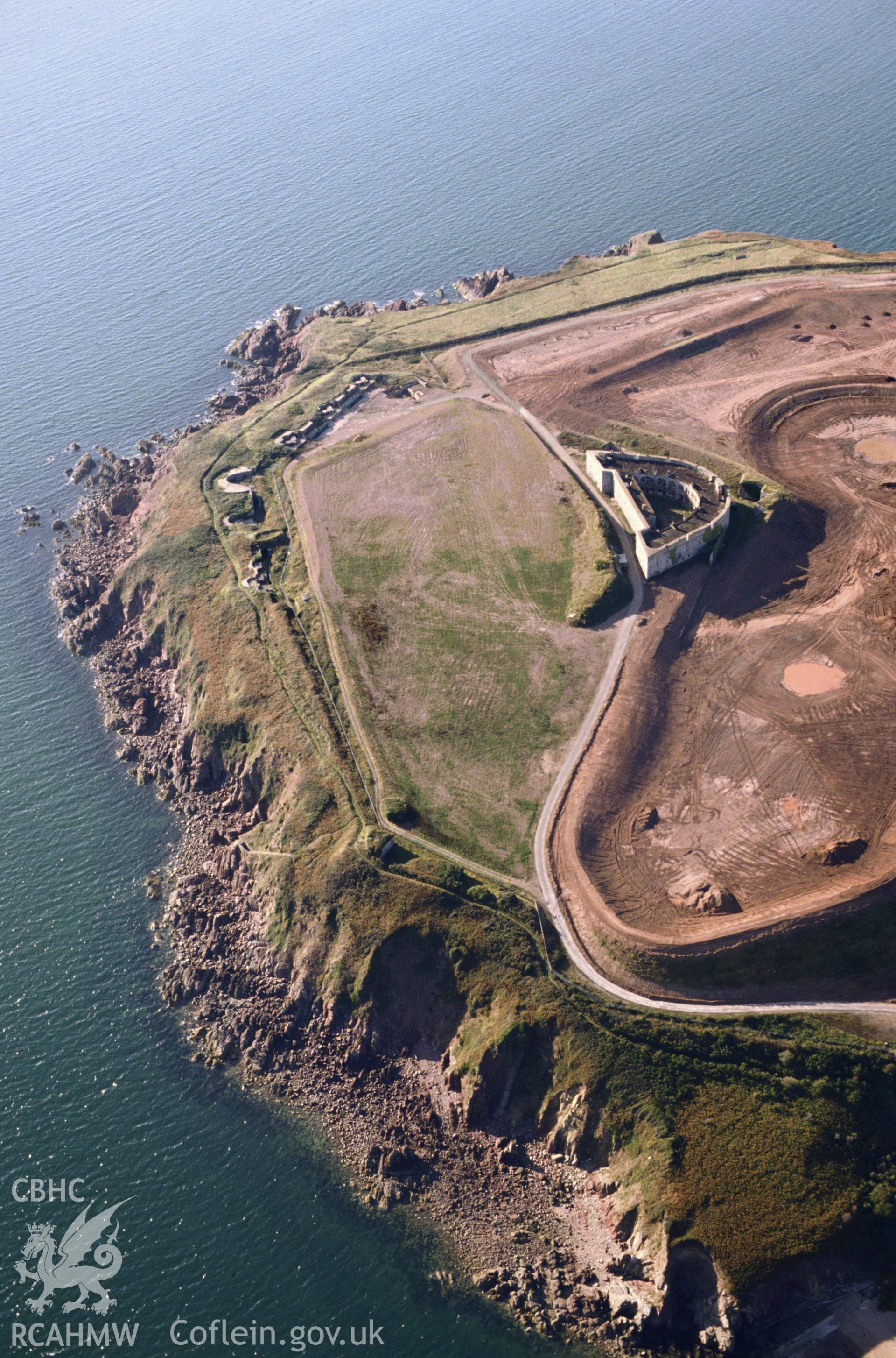 Slide of RCAHMW colour oblique aerial photograph of South Hook Fort, taken by C.R. Musson, 1990.