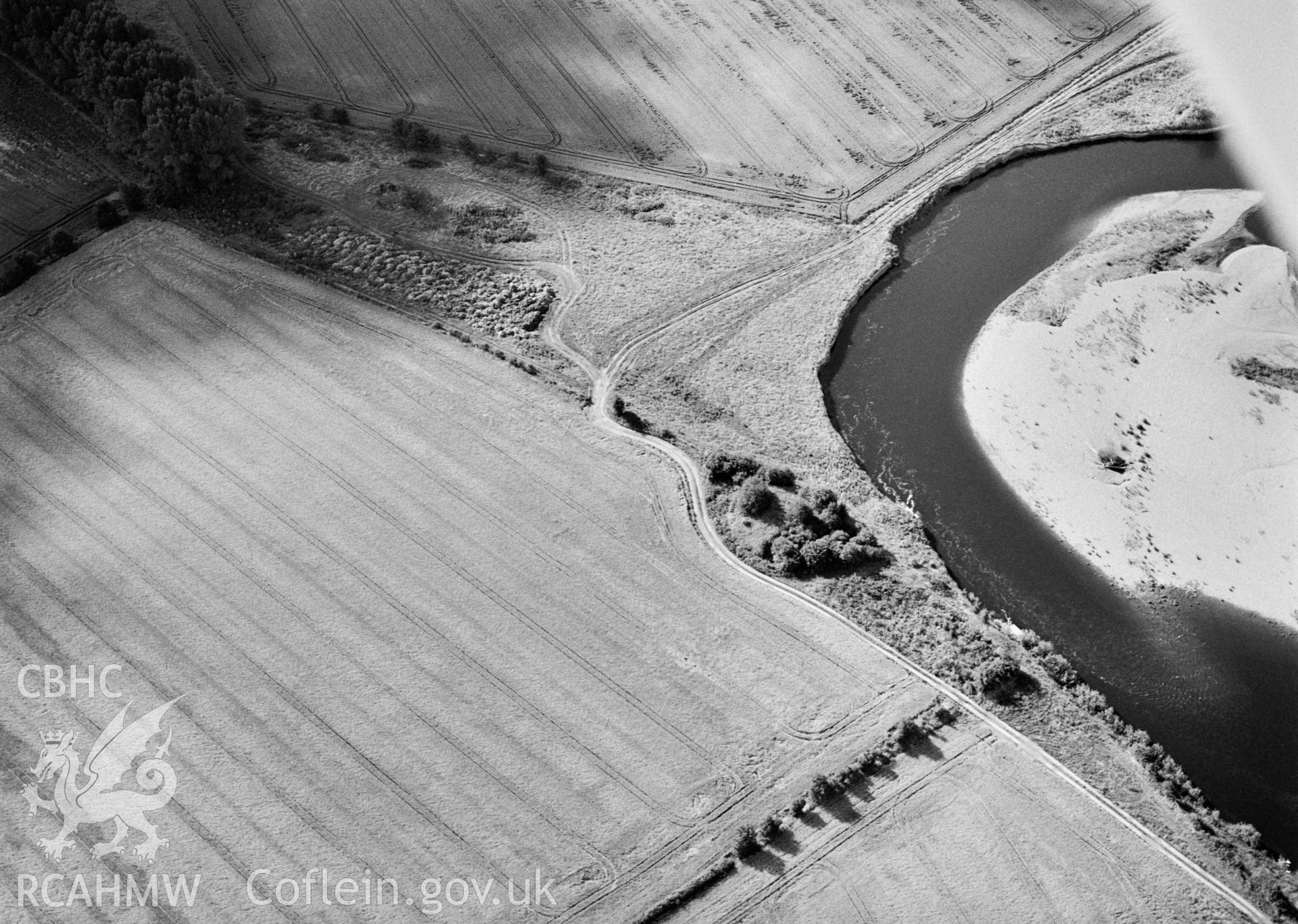 RCAHMW Black and white oblique aerial photograph of Llowes Motte, Glasbury, taken on 24/07/1998 by Toby Driver