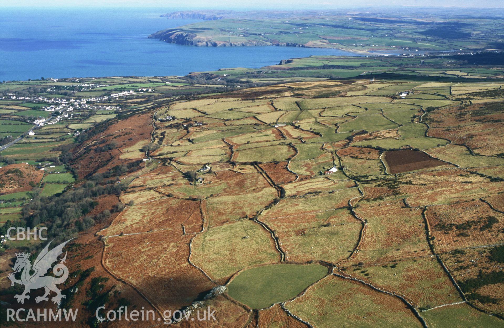 RCAHMW colour slide oblique aerial photograph of field system at Mynydd Dinas, Dinas Cross, taken by C.R.Musson on the 27/02/1996