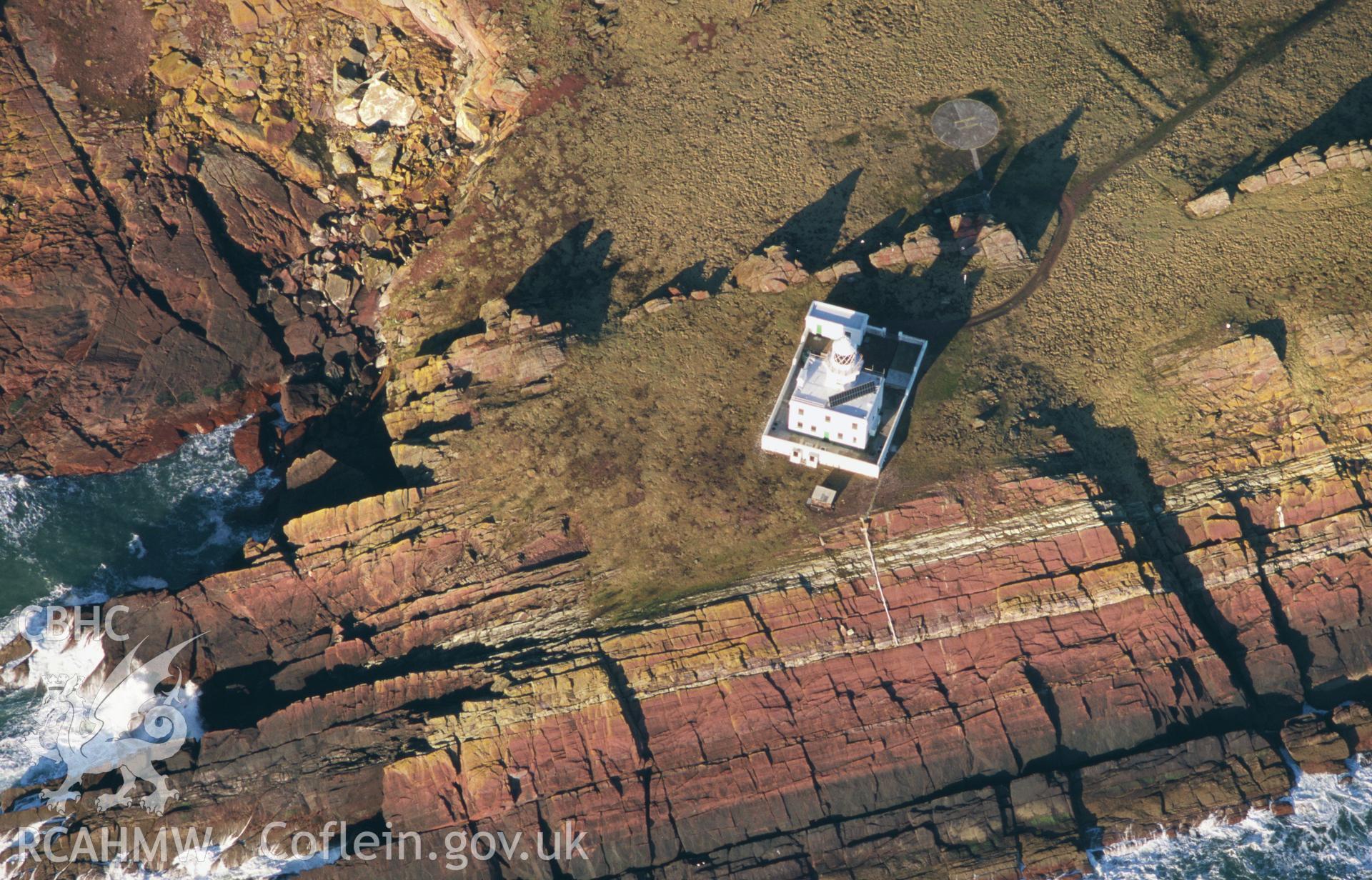 Slide of RCAHMW colour oblique aerial photograph of Skokholm Island Lighthouse, taken by T.G. Driver, 2001.