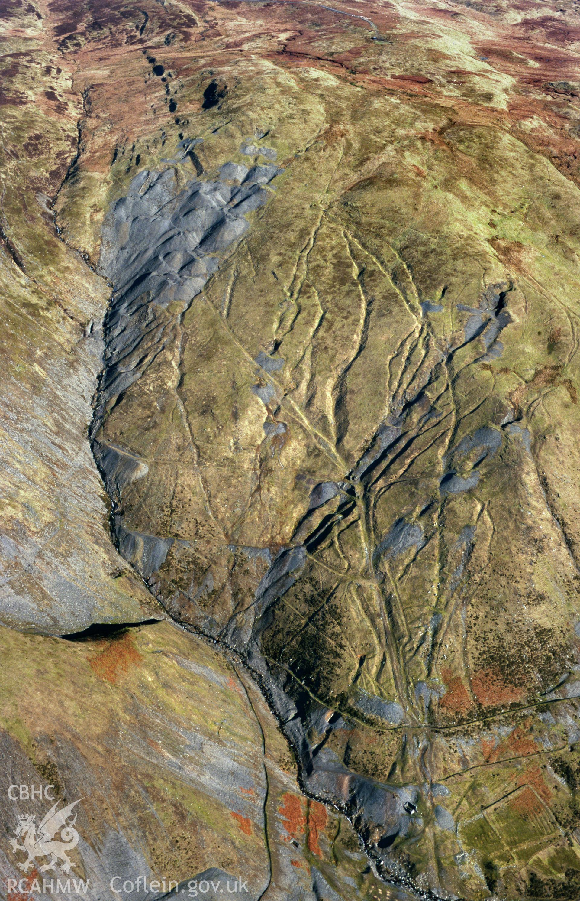Slide of RCAHMW colour oblique aerial photograph showing Copa Hill Copper, Lead and Zinc Mines, Cwmystwyth, taken by Toby Driver, 2001.