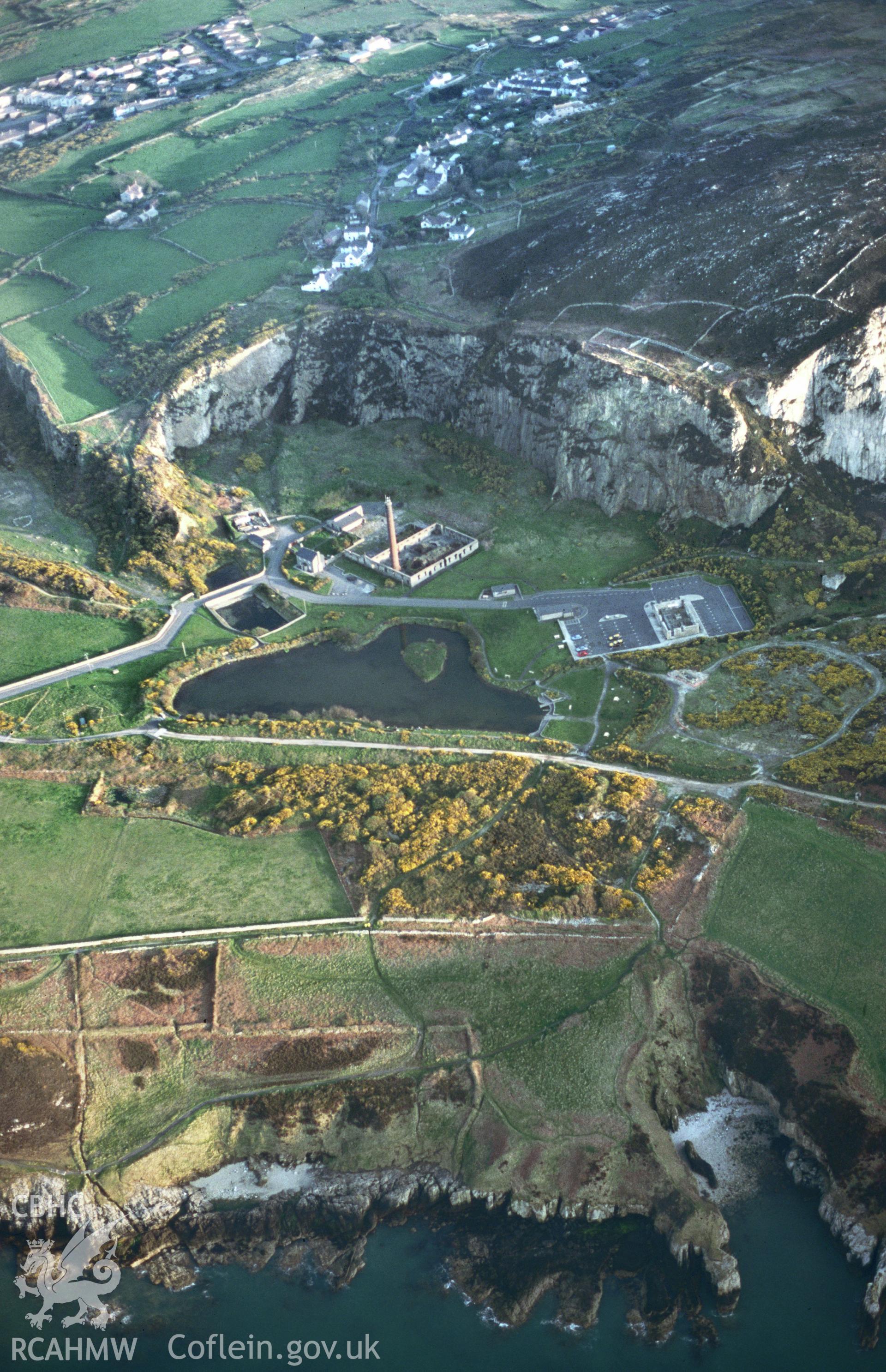 RCAHMW colour slide oblique aerial photograph of Breakwater Quarry and Brickworks, Holyhead, taken on 28/04/1999 by Toby Driver