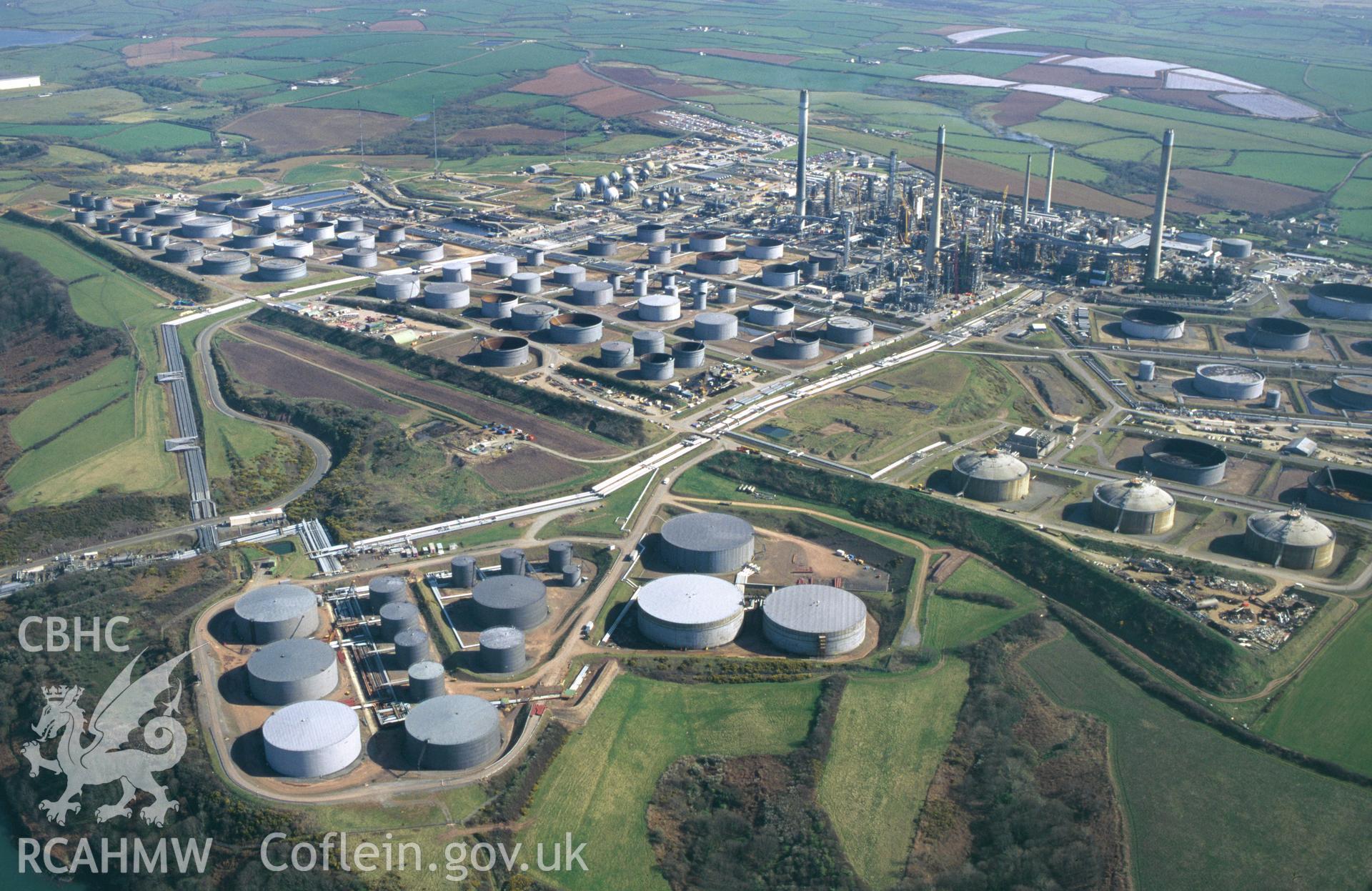 RCAHMW colour oblique aerial photograph of Rhoscrowther Oil Refinery, Milford Haven. Taken on 13 April 1995 by C.R. Musson