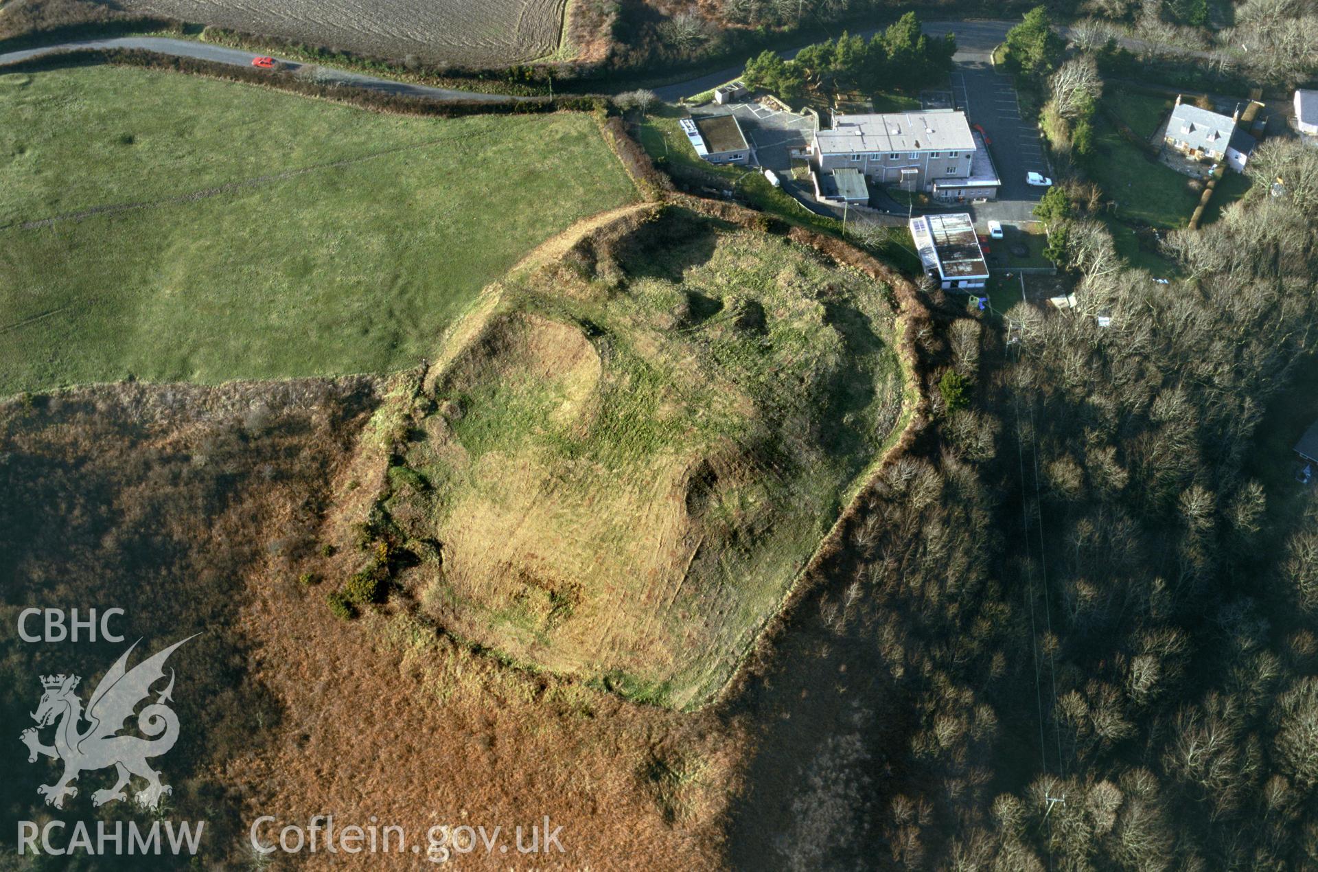 RCAHMW colour slide oblique aerial photograph of enclosure at Strawberry Hill, The Havens, taken by C.R.Musson on the 27/02/1996