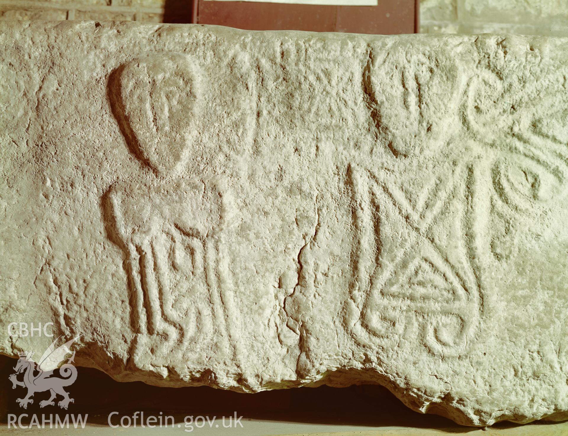 Colour transparency showing  view of stone relief figures at Llanrhidian Church, Glamorgan, produced by R.G. Nicol, c.1980