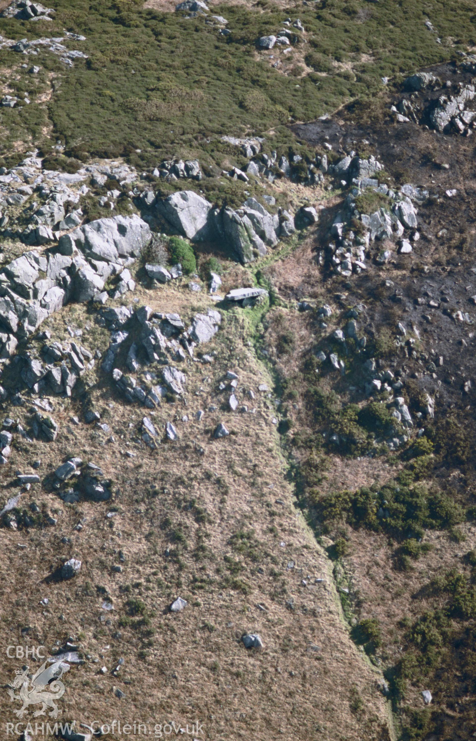 Slide of RCAHMW colour oblique aerial photograph of Carn Wnda, Pencaer taken by T.G. Driver, 2002.