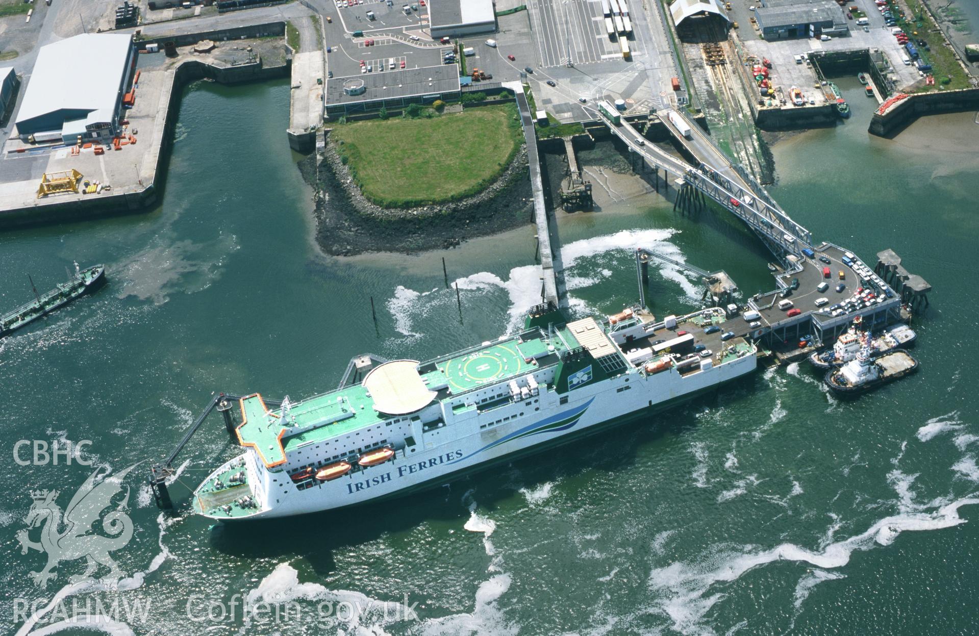 RCAHMW colour oblique aerial photograph of Pembroke Dock; Irish Sea Ferry docked with cars leaving. Taken by Toby Driver on 13/06/2003