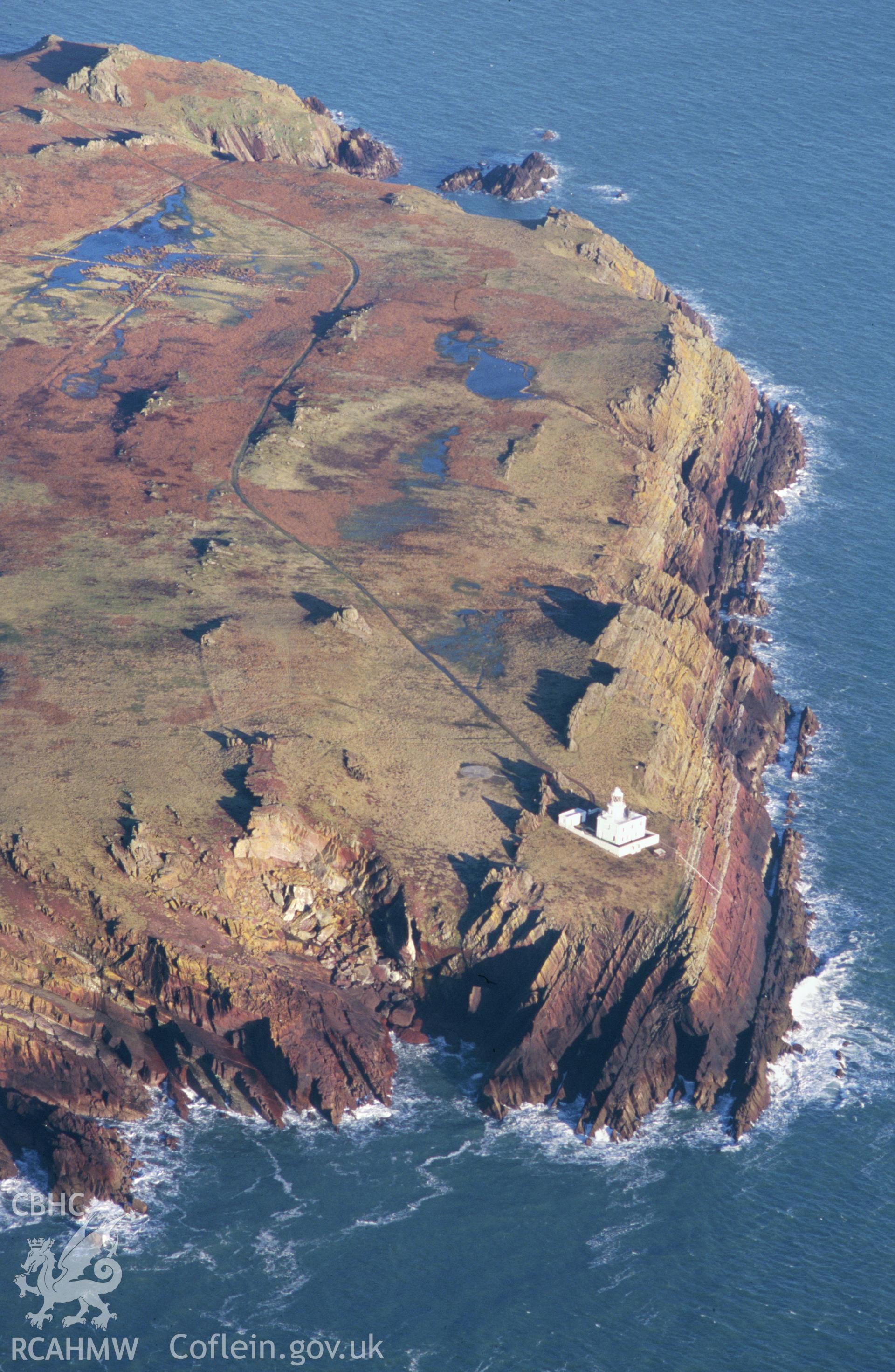 Slide of RCAHMW colour oblique aerial photograph of Skokholm Island Lighthouse, taken by T.G. Driver, 2001.