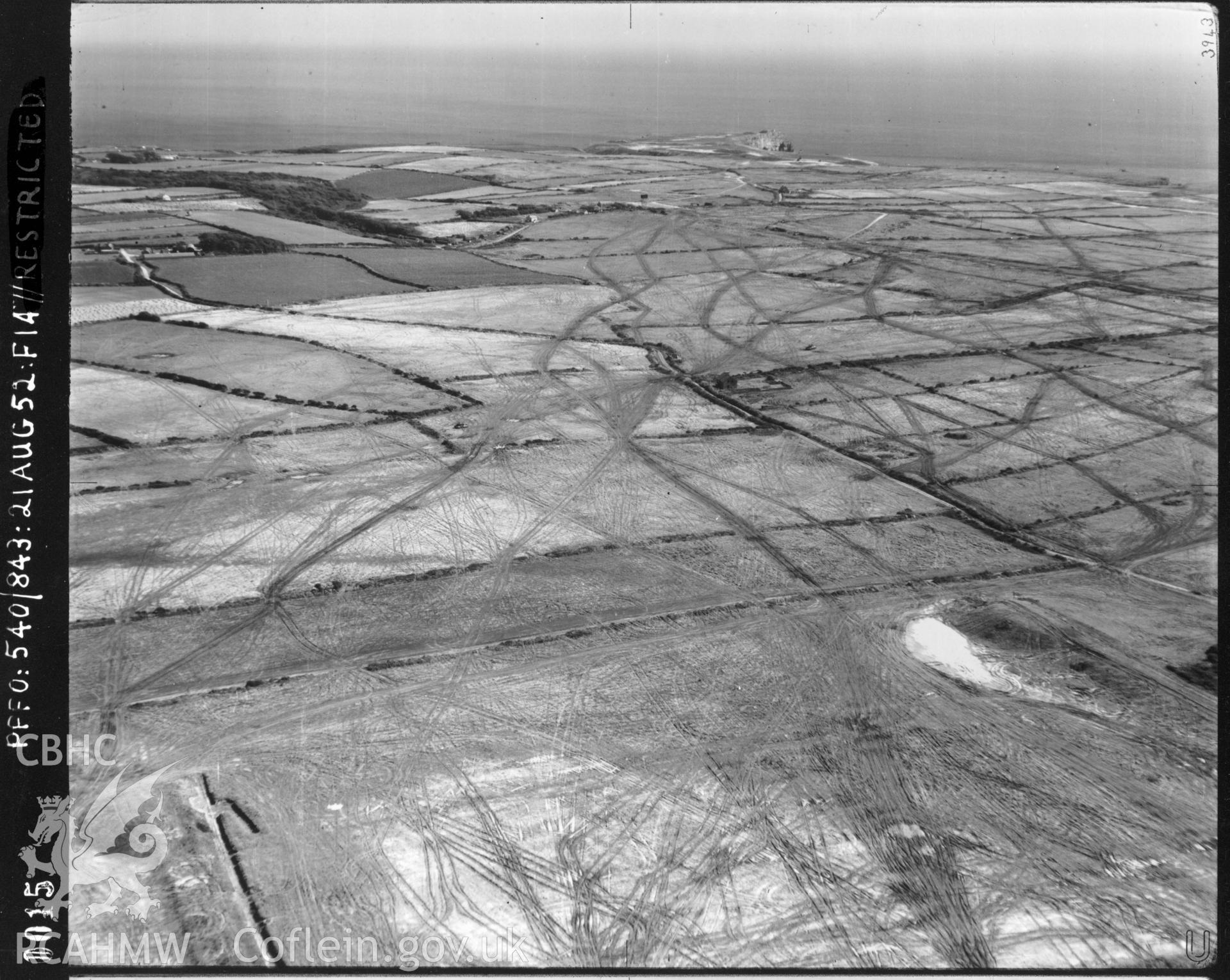 Black and white oblique aerial photograph taken by the RAF in 1952, centred on Thornston, Bosherston and the Castlemartin Range.