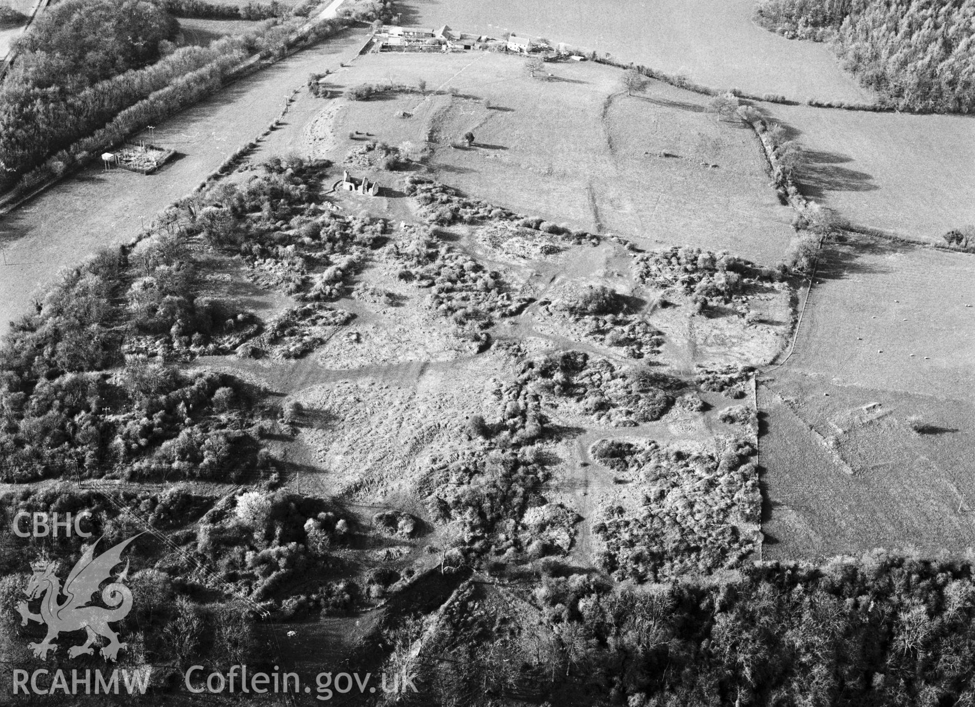 RCAHMW Black and white oblique aerial photograph of Runston Settlement Earthworks, Mathern, taken by C.R. Musson, 24/03/94