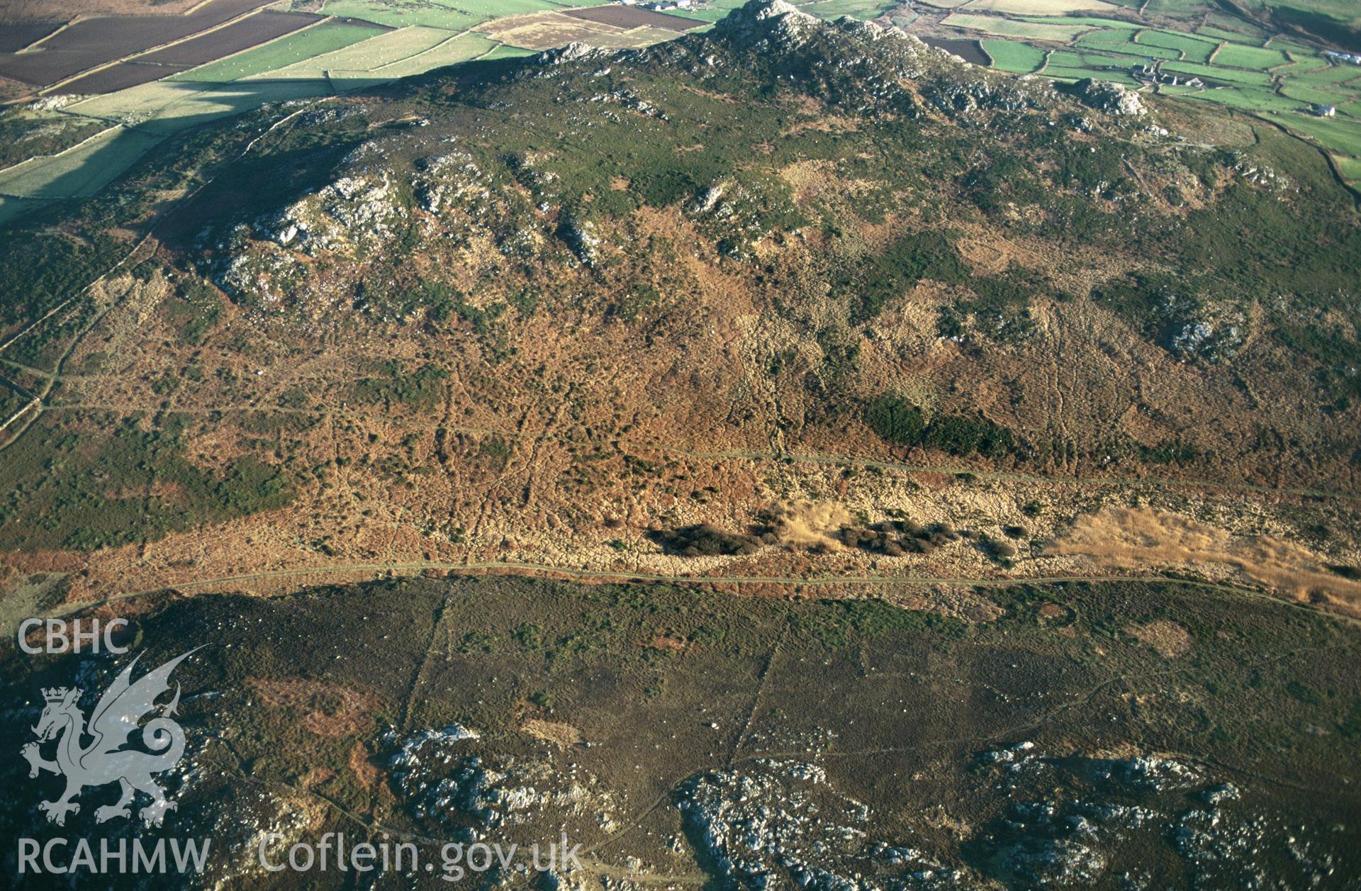 RCAHMW colour slide oblique aerial photograph of Carn Llidi Enclosures;  Penmaen Dewi Field System, St Davids and the Cathedral Close, taken by C.R.Musson on the 07/02/1997