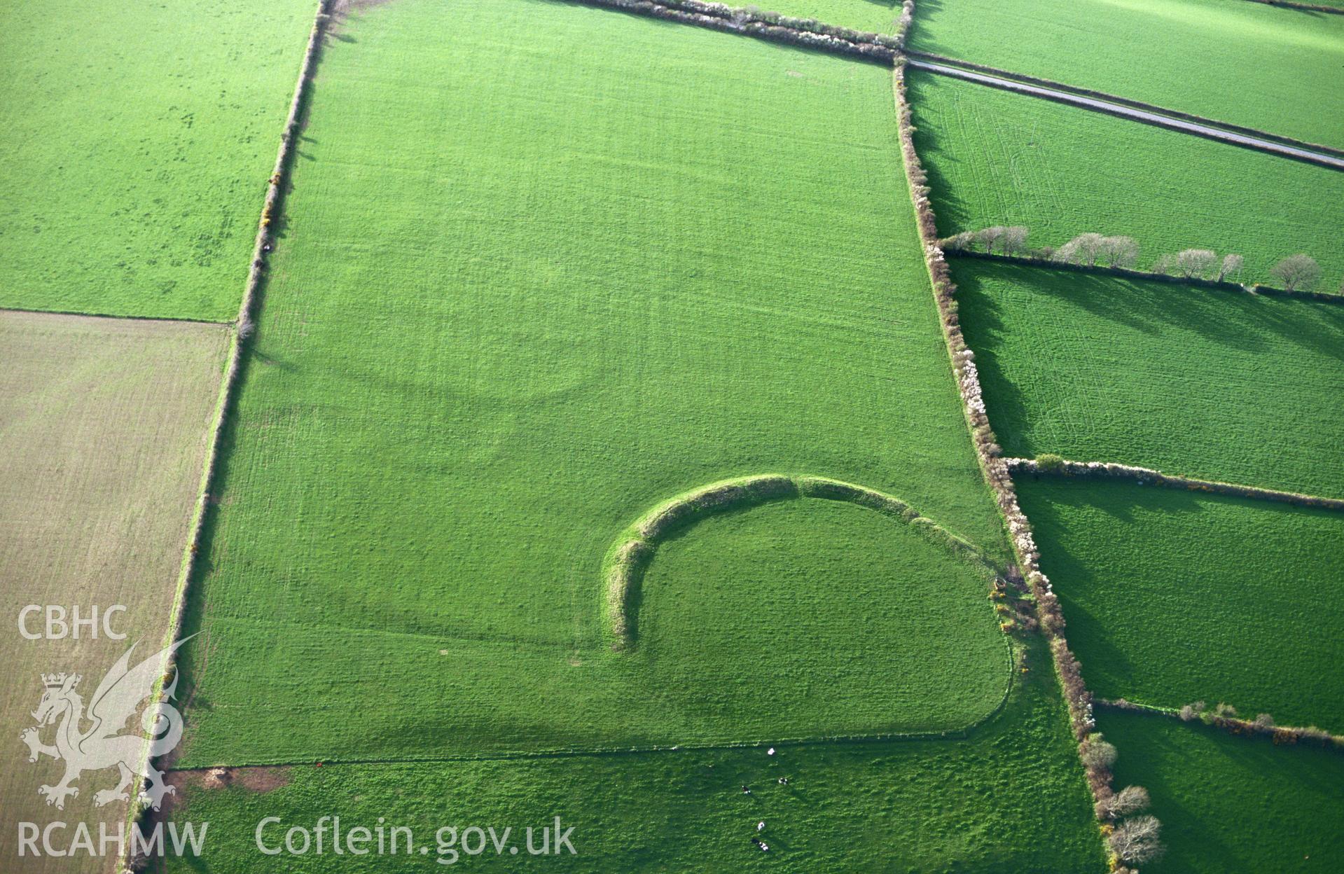 RCAHMW colour slide oblique aerial photograph of Caer Penpicas, Trecwn, taken by C.R.Musson on the 28/04/1996