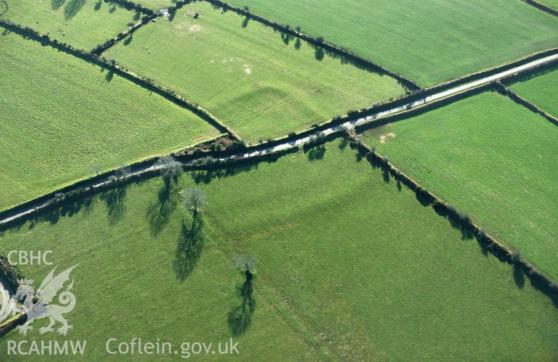 RCAHMW colour slide oblique aerial photograph of Castle Flemish; Castle Fleming, Puncheston;ambleston, taken by C.R.Musson on the 07/02/1997